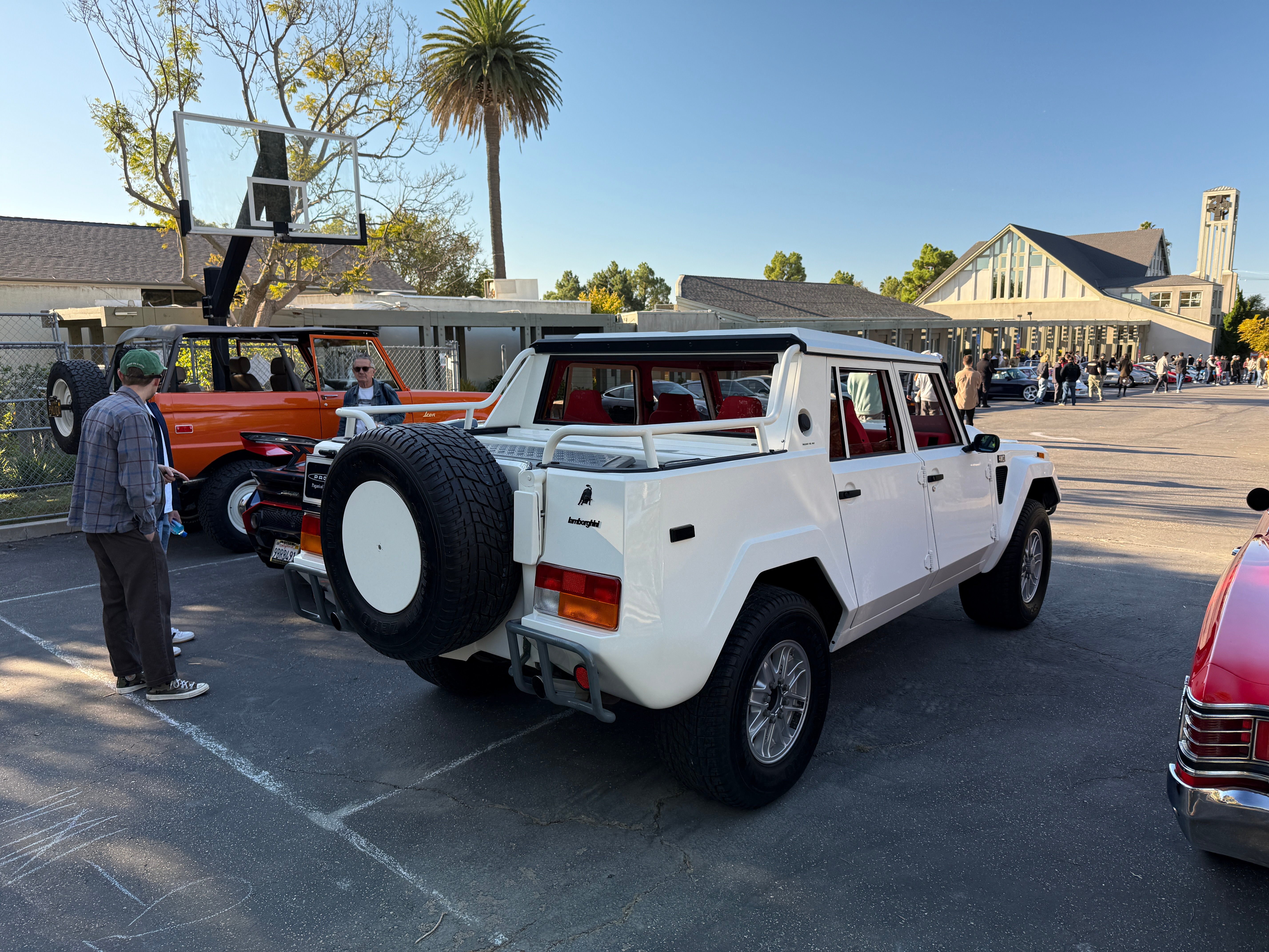 Rear 3/4 view of a white Lamborghini LM002