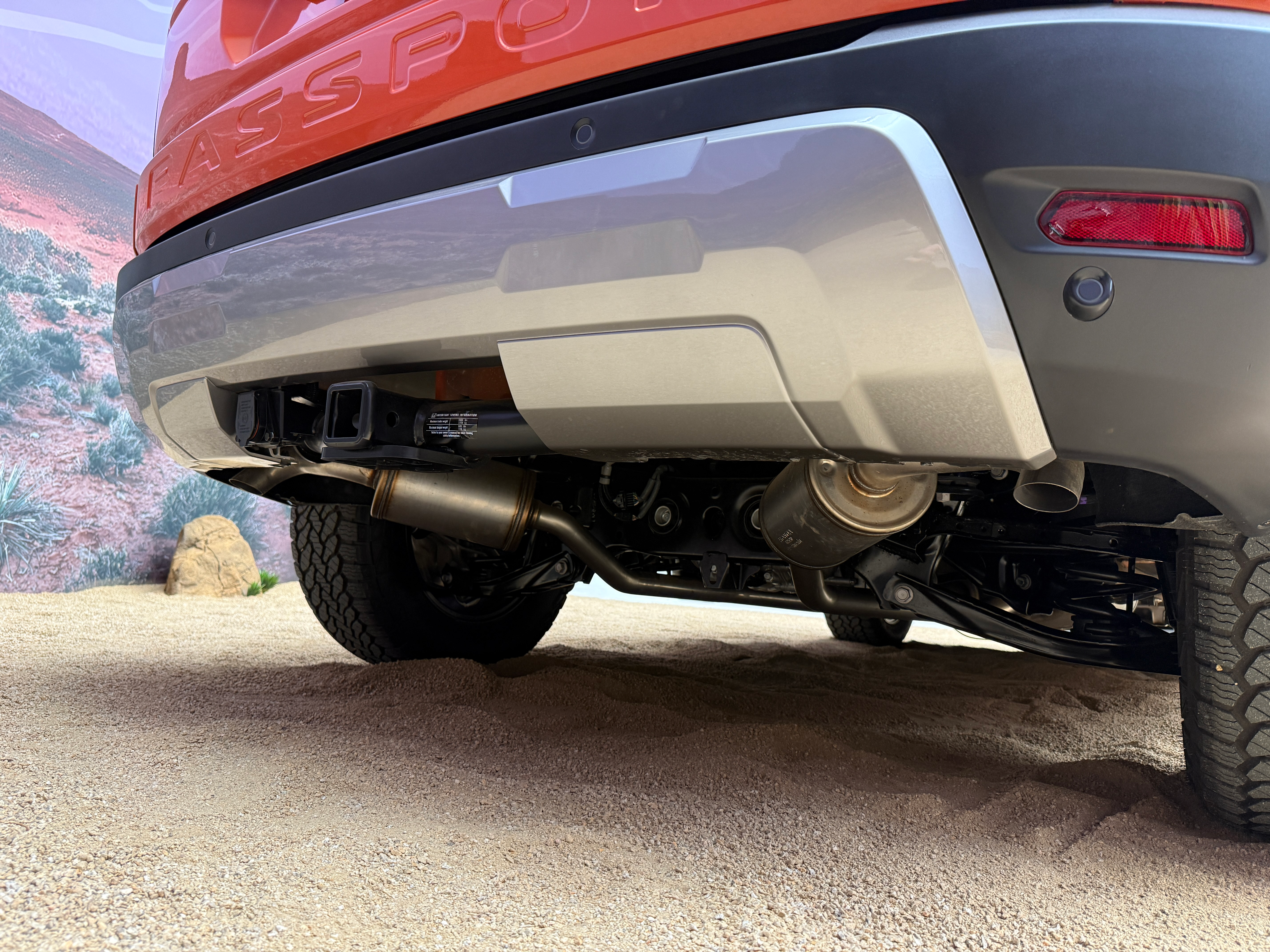 Rear bumper of an orange 2026 Honda Passport TrailSport