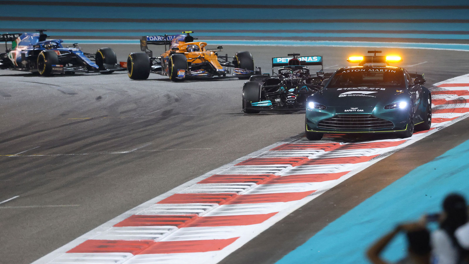 The F1 cars follow the safety car in Abu Dhabi 