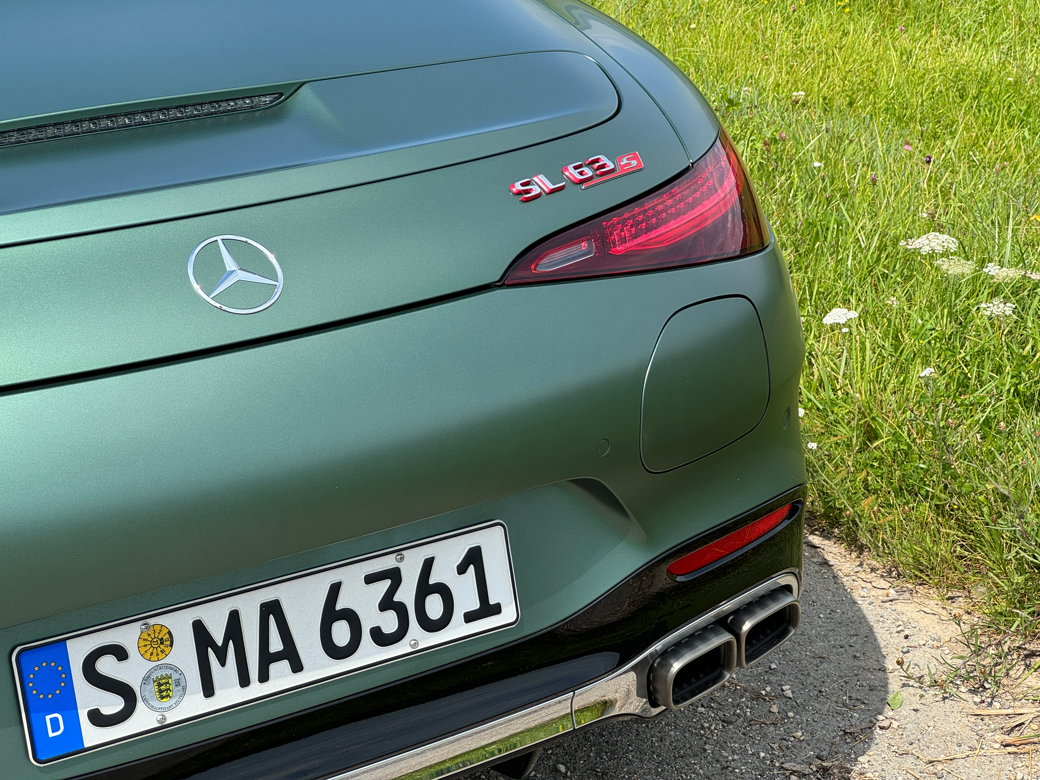 Rear end of a matte green Mercedes-AMG SL63 S E Performance