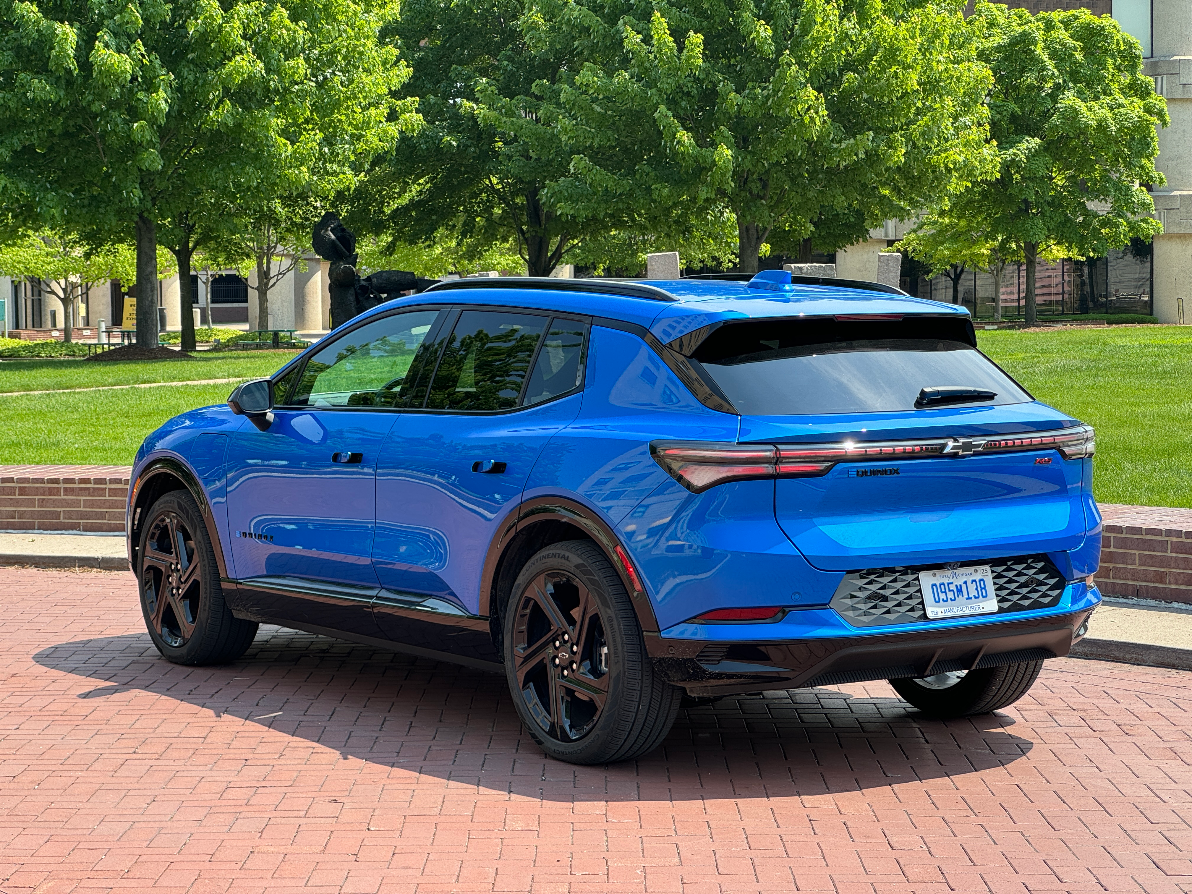 Rear 3/4 view of a blue 2024 Chevrolet Equinox EV