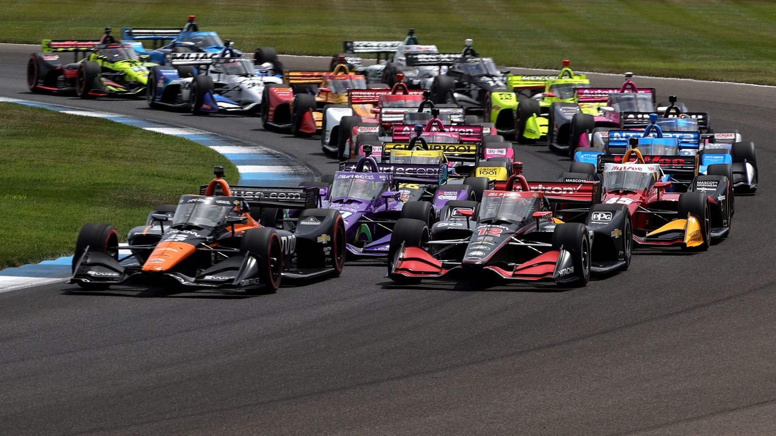 A photo of the cars lining up for the start of an IndyCar race. 