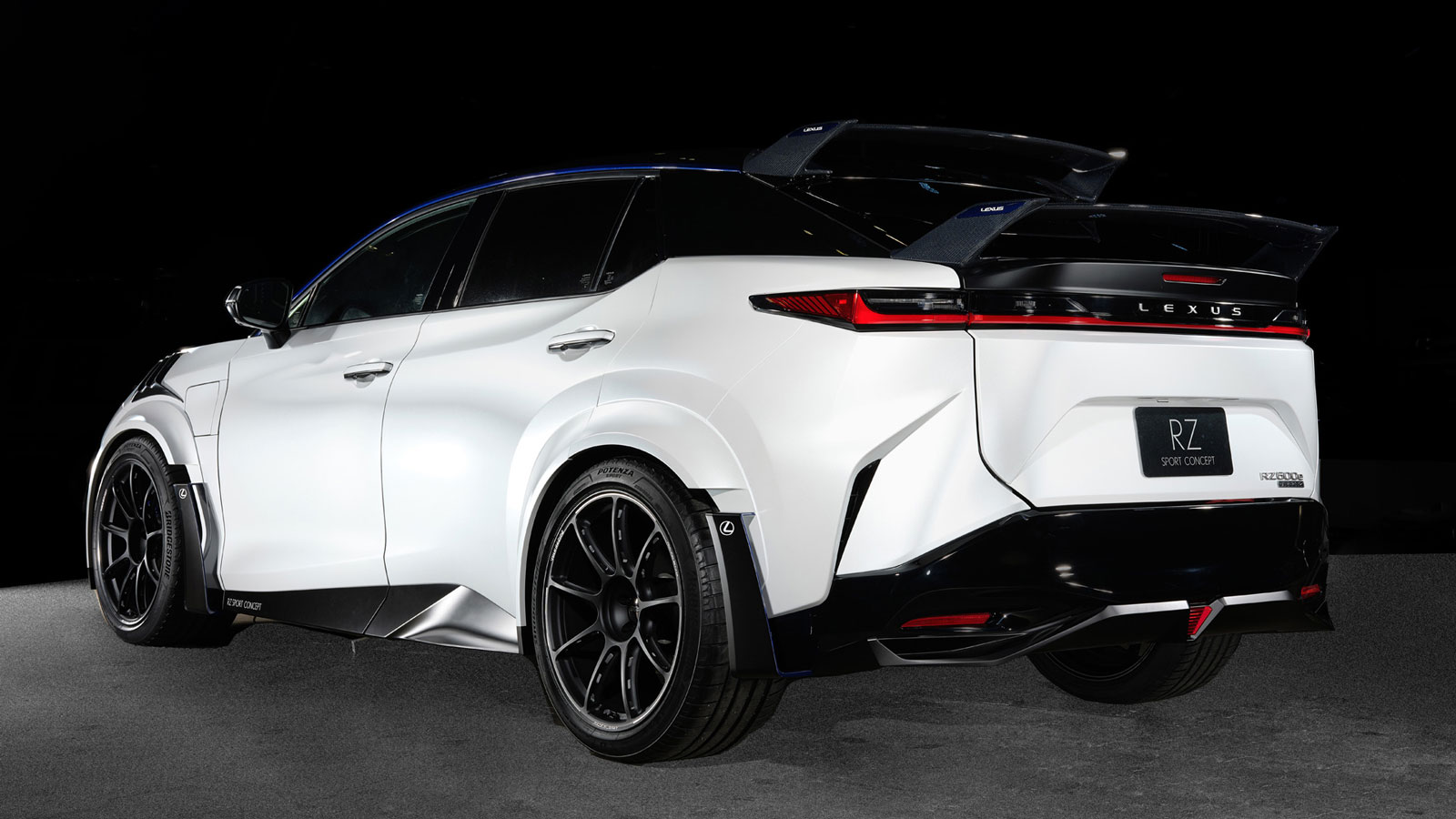 A photo of the rear quarter of the black and white Lexus RZ SUV concept car. 