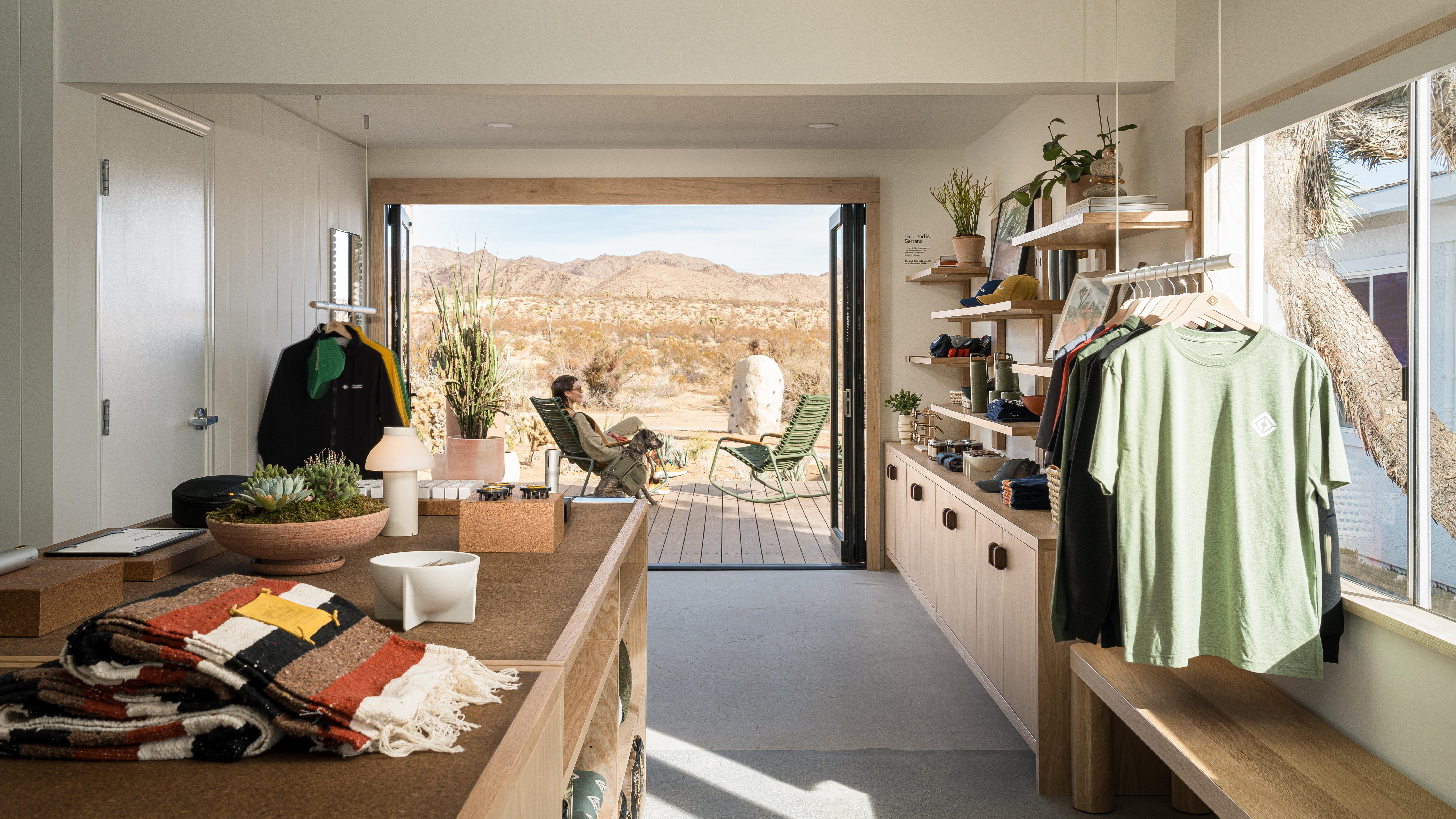 a photo looking out of the charging outpost showing clothes and lounge chairs