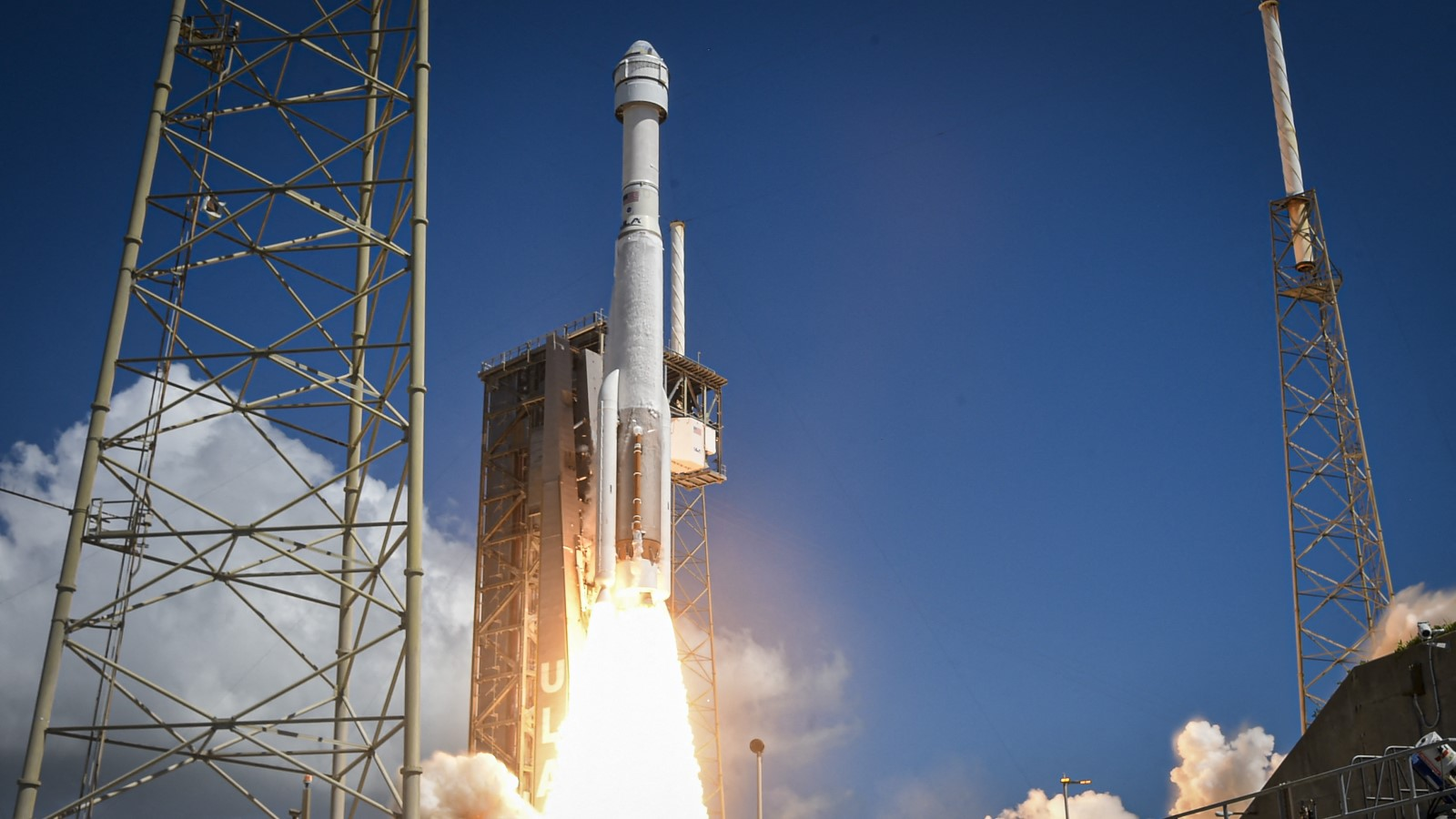 A photo of Starliner launching to space on a rocket. 