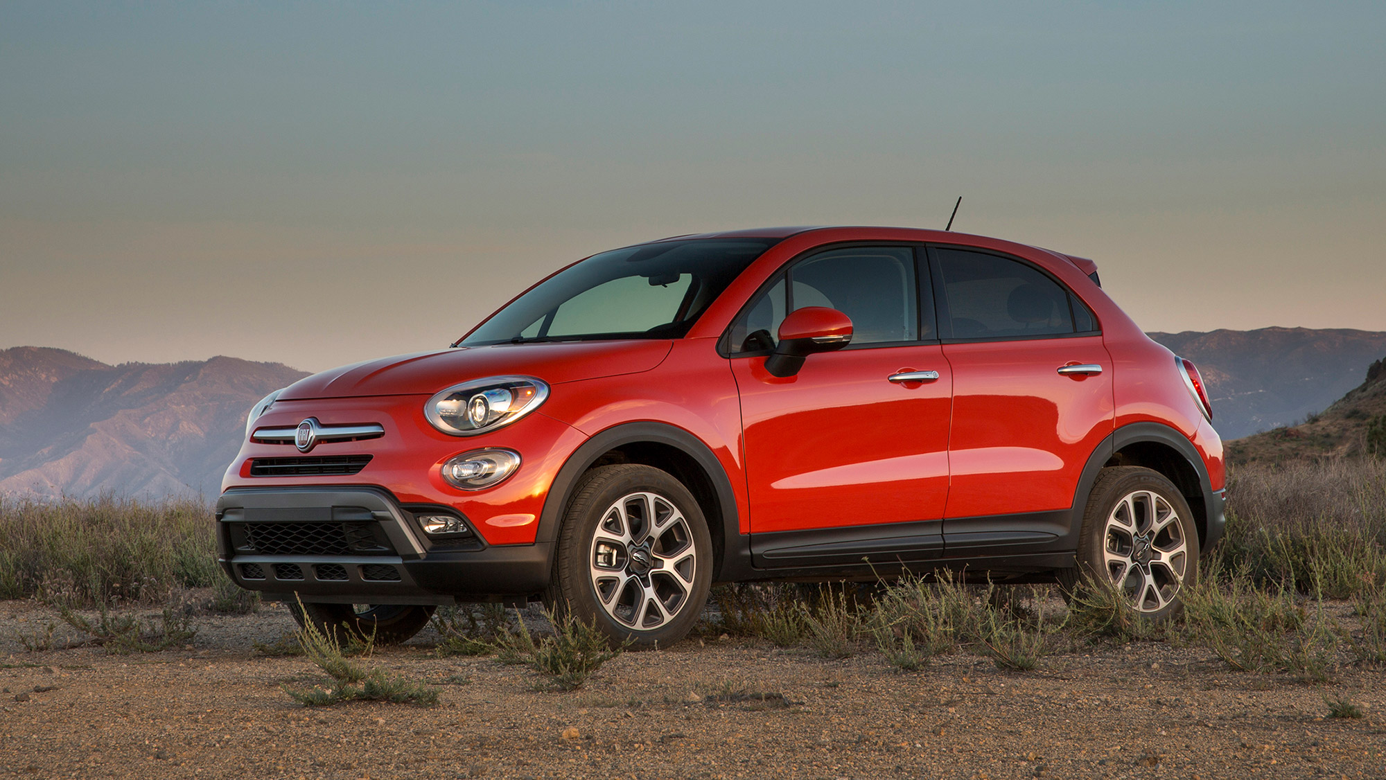 A red Fiat 500X viewed from a front-quarter angle