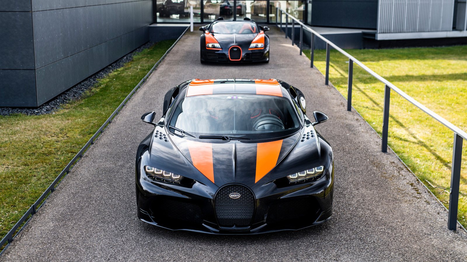 A photo of a Bugatti Chiron and Veyron lined up. 