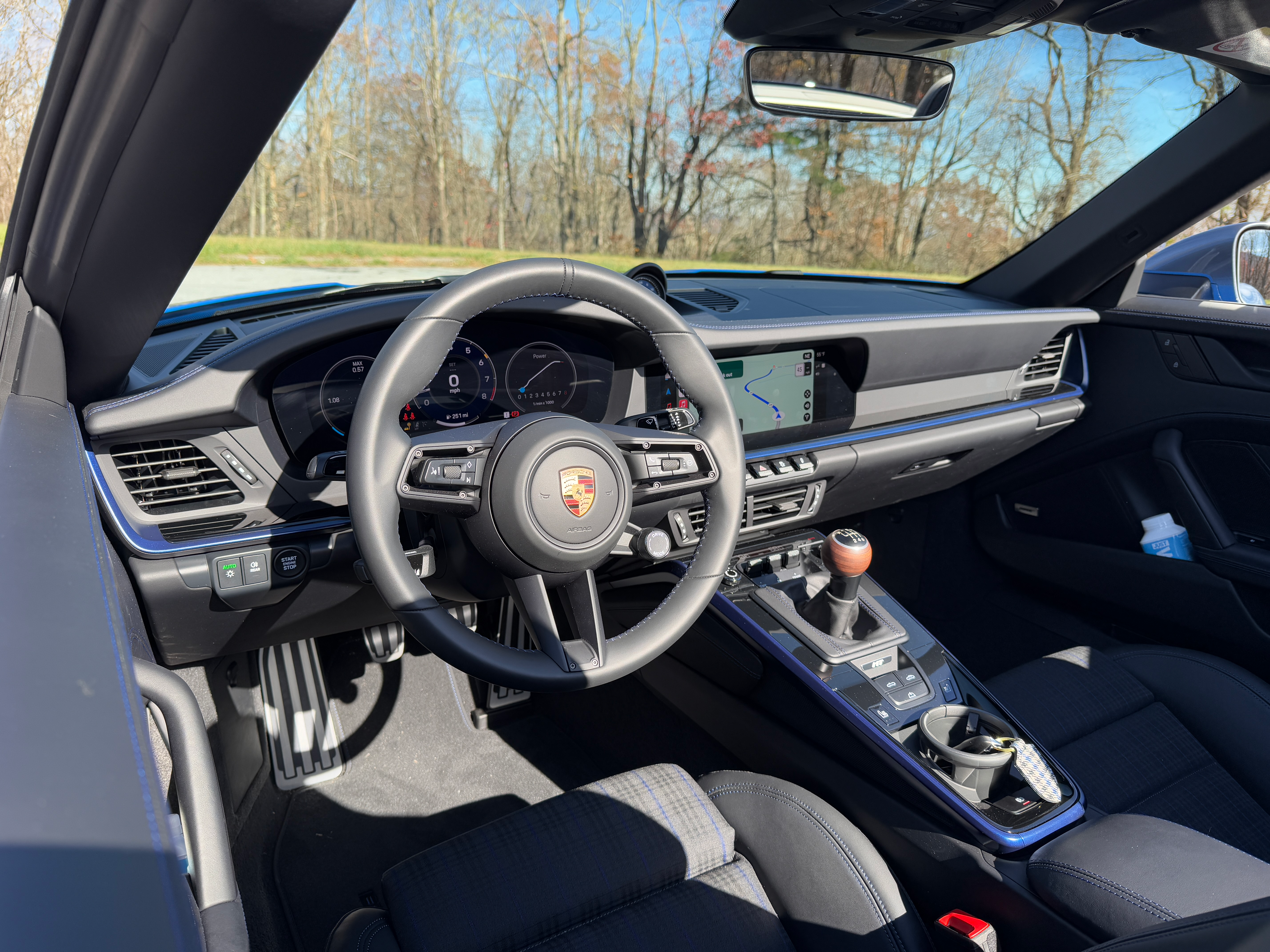 Interior of a blue 2025 Porsche 911 Carrera T cabriolet