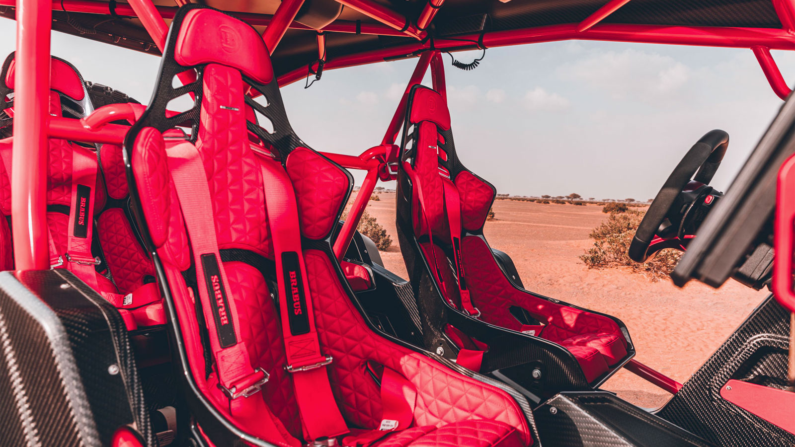 A photo of the bright red interior of the Brabus Crawler dune buggy. 