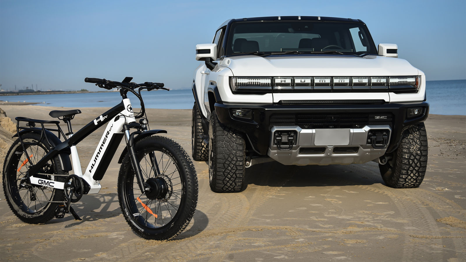 A photo of a Hummer Ev and a Hummer E-Bike. 