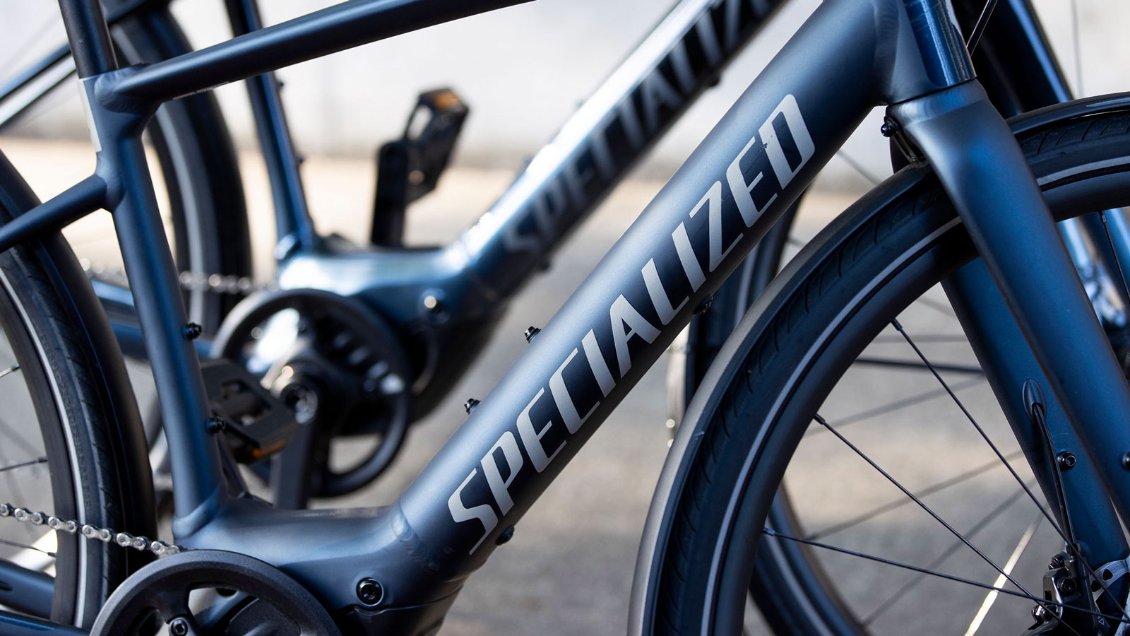 A photo of the Specialized logo on two electric bikes. 