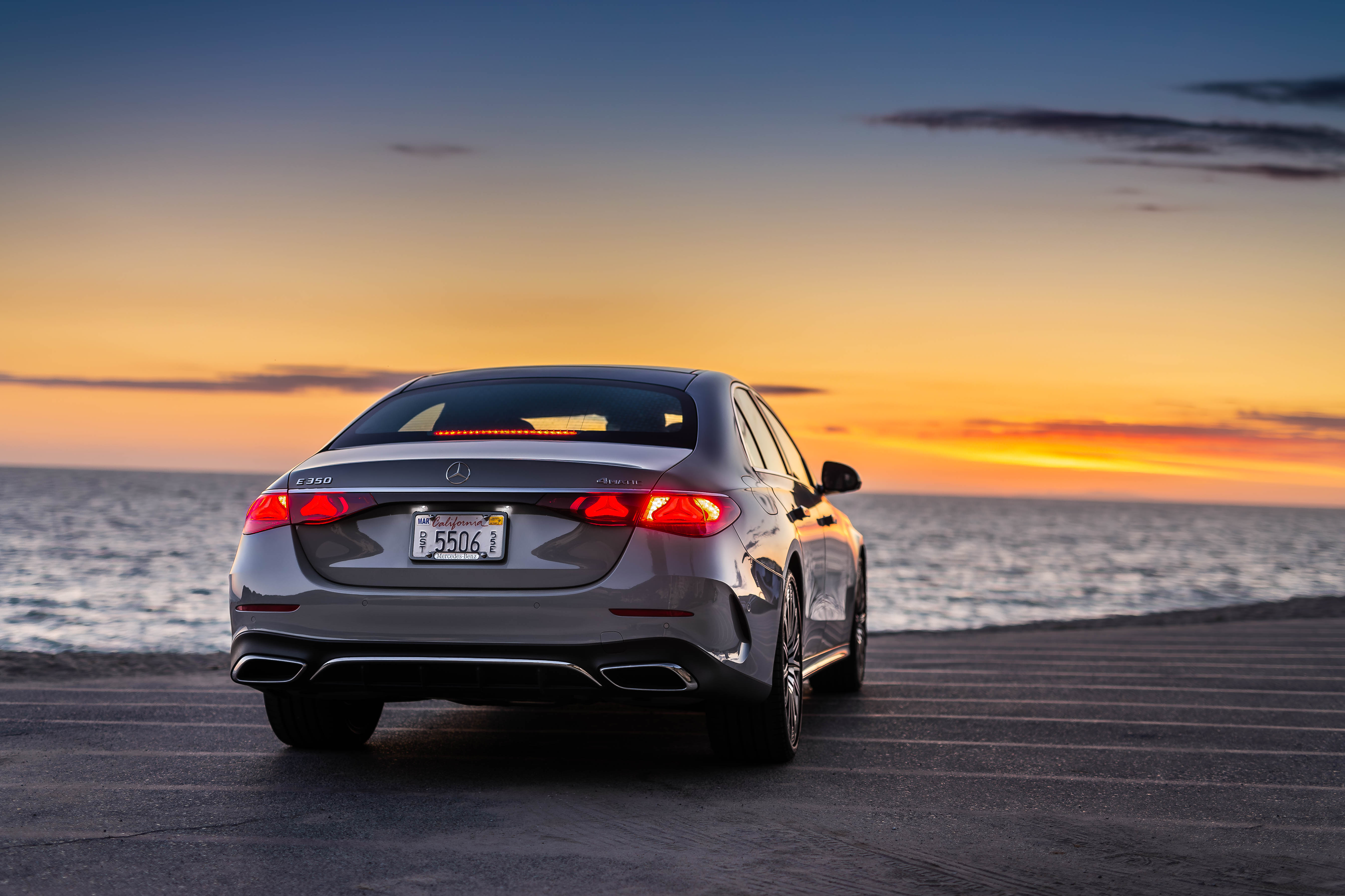 Rear 3/4 view of a grey 2024 Mercedes-Benz E350