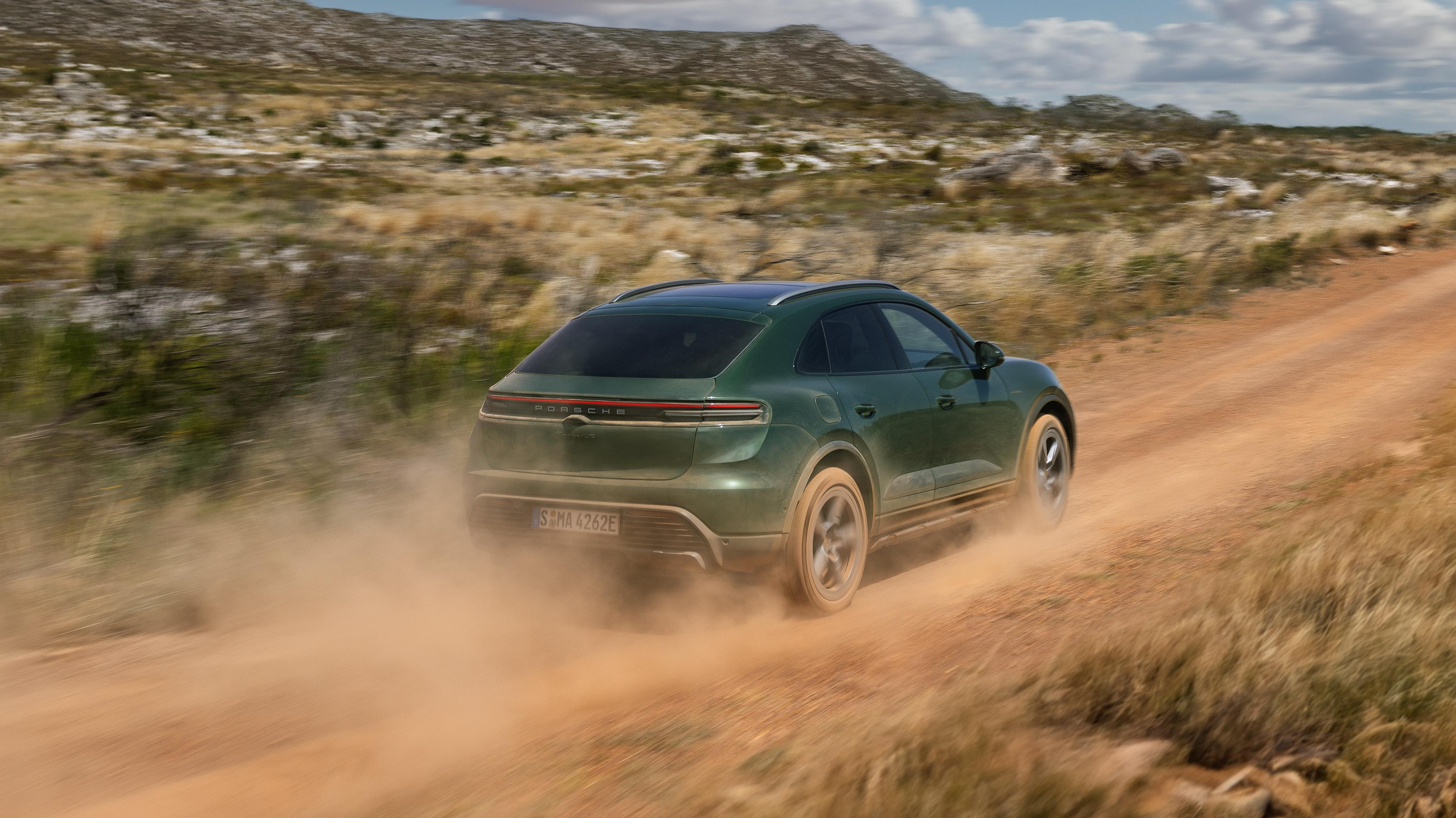 Rear 3/4 view of a green Porsche Macan 4S EV