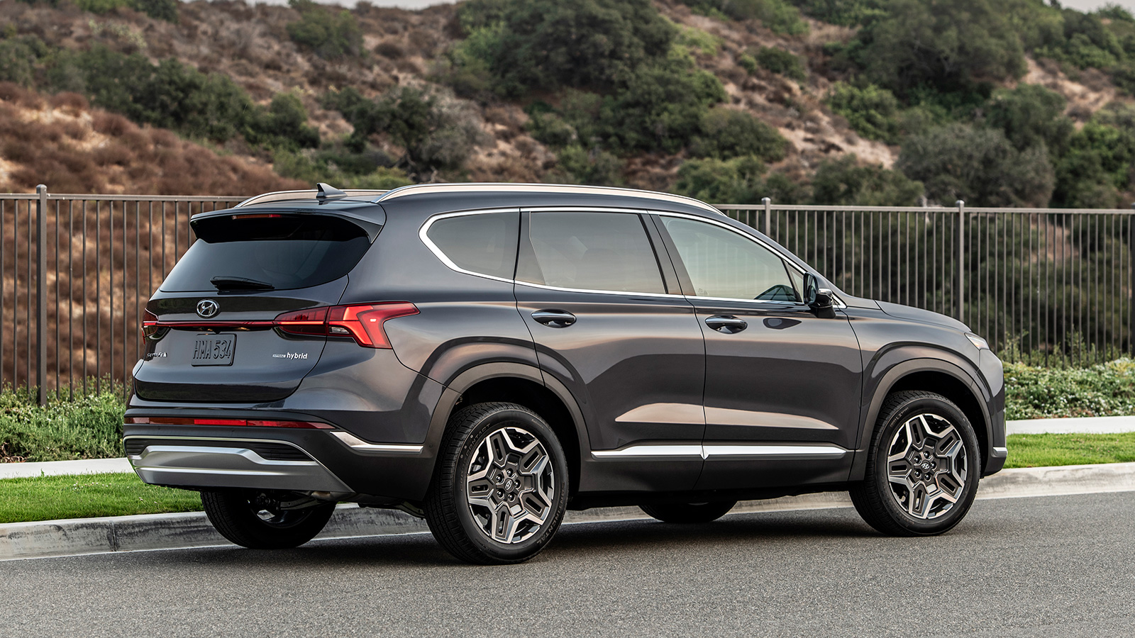 Rear three-quarter image of black 2023 Hyundai Santa Fe