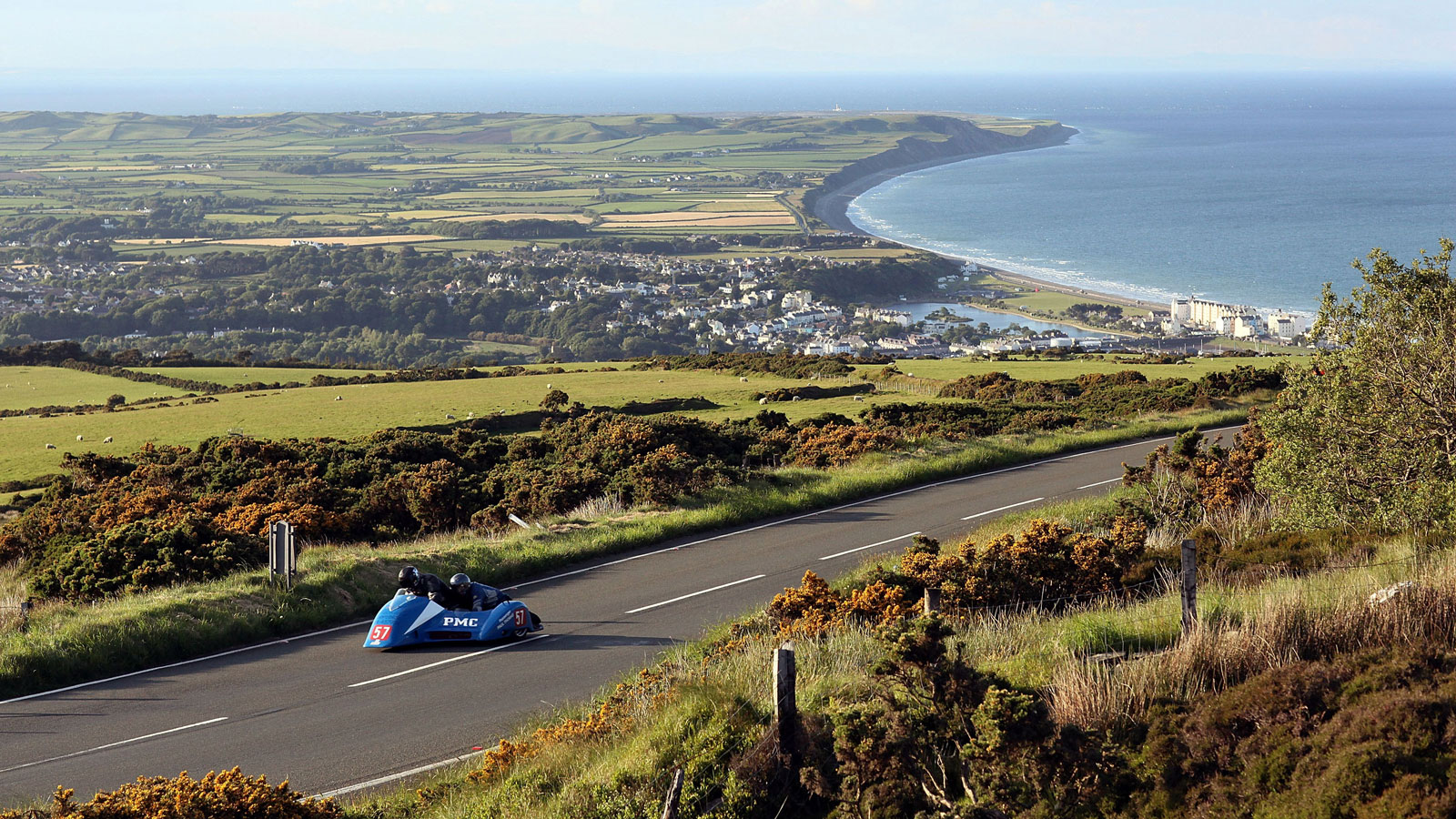 A photo of a part of the Isle of Man TT circuit overlooking the town of Ramsay on the island. 