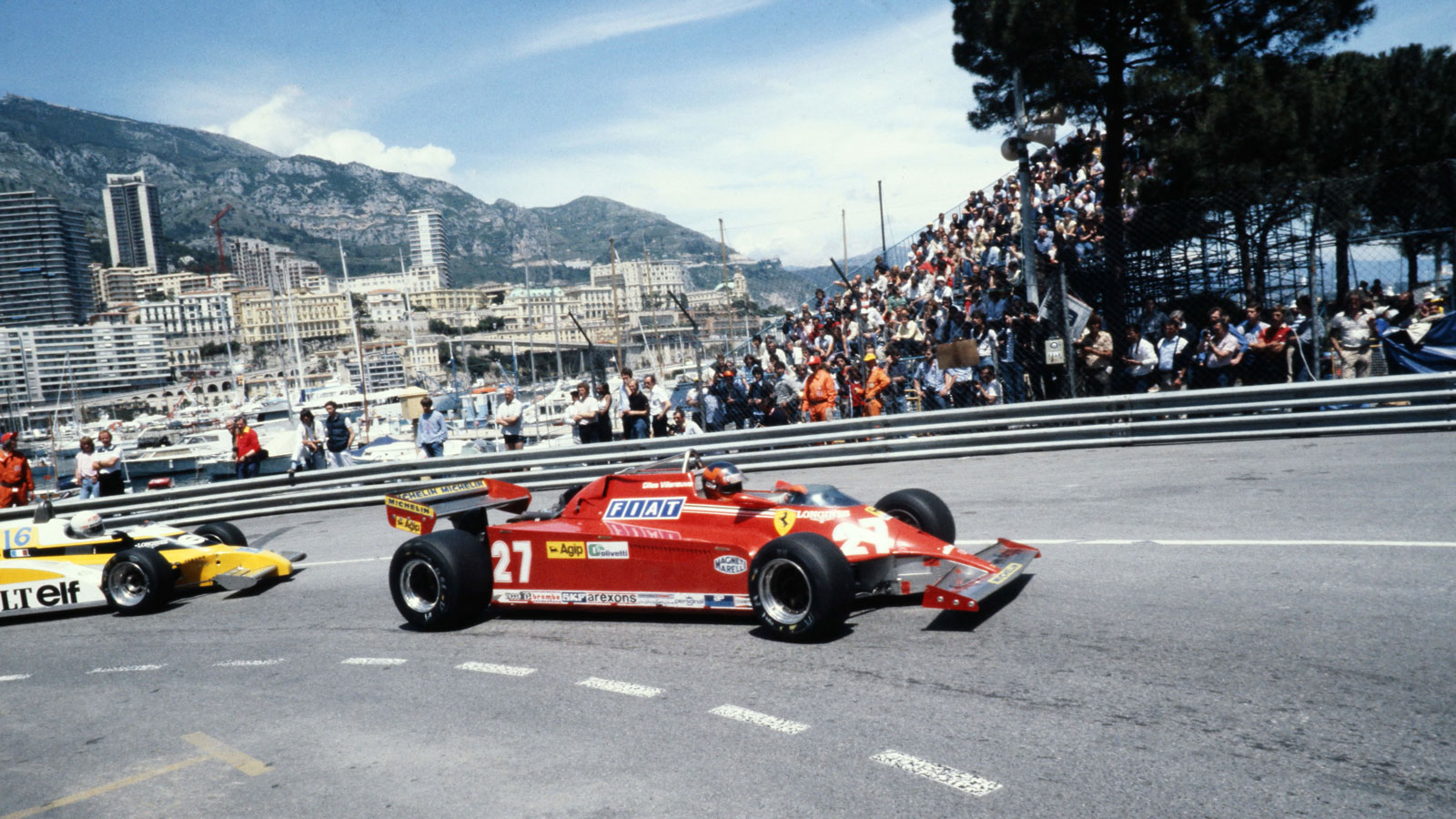 A red Ferrari 126C on the streets of Monaco in the 1980s. 