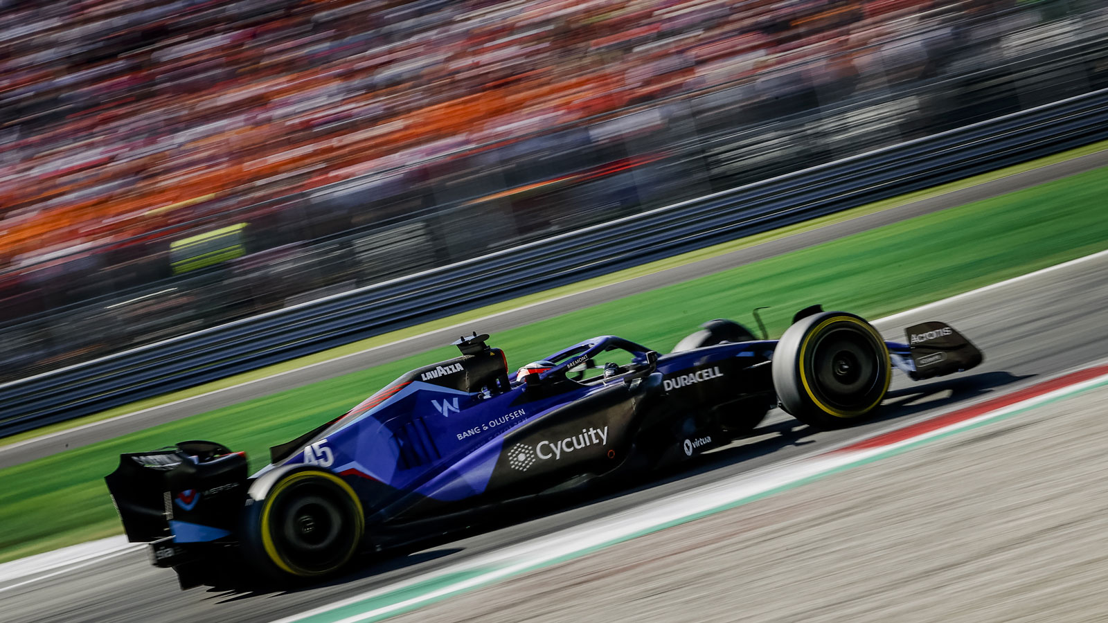 A photo of Nyck de Vries racing a Williams F1 car in Italy. 