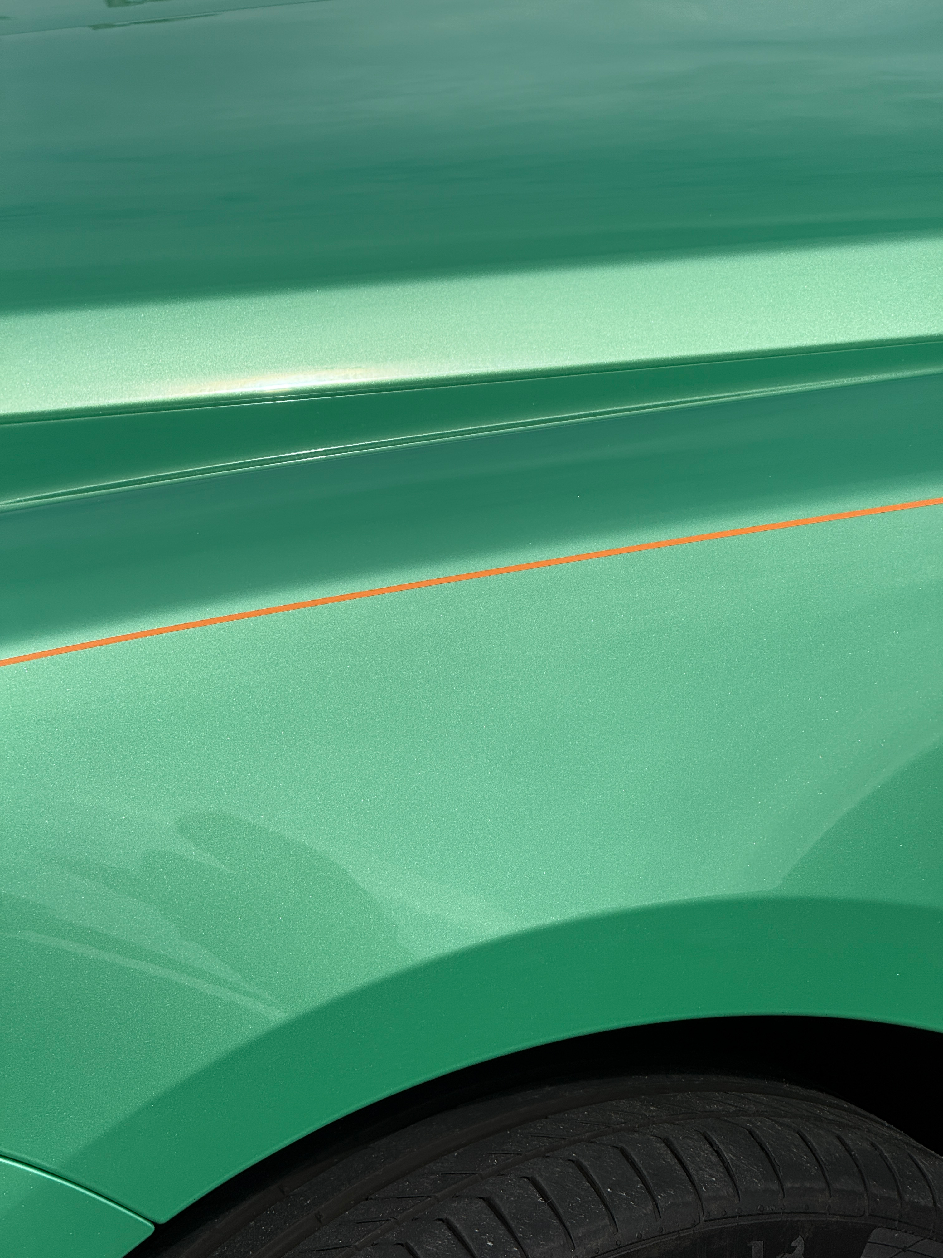 Front fender detail of a green Rolls-Royce Cullinan Black Badge