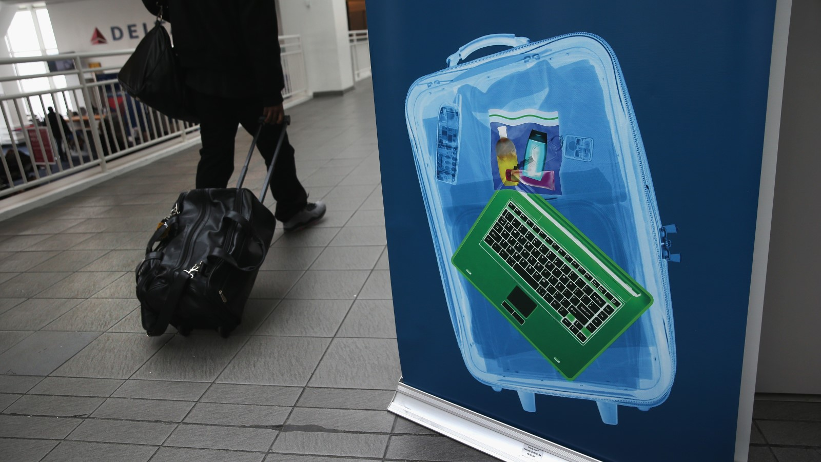 A photo of a suitcase after being scanned by an x-ray machine. 