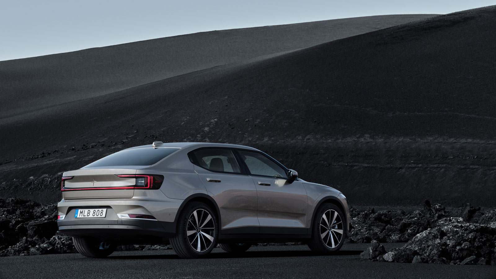 A photo of the rear quarter on a beige Polestar 2 EV. 