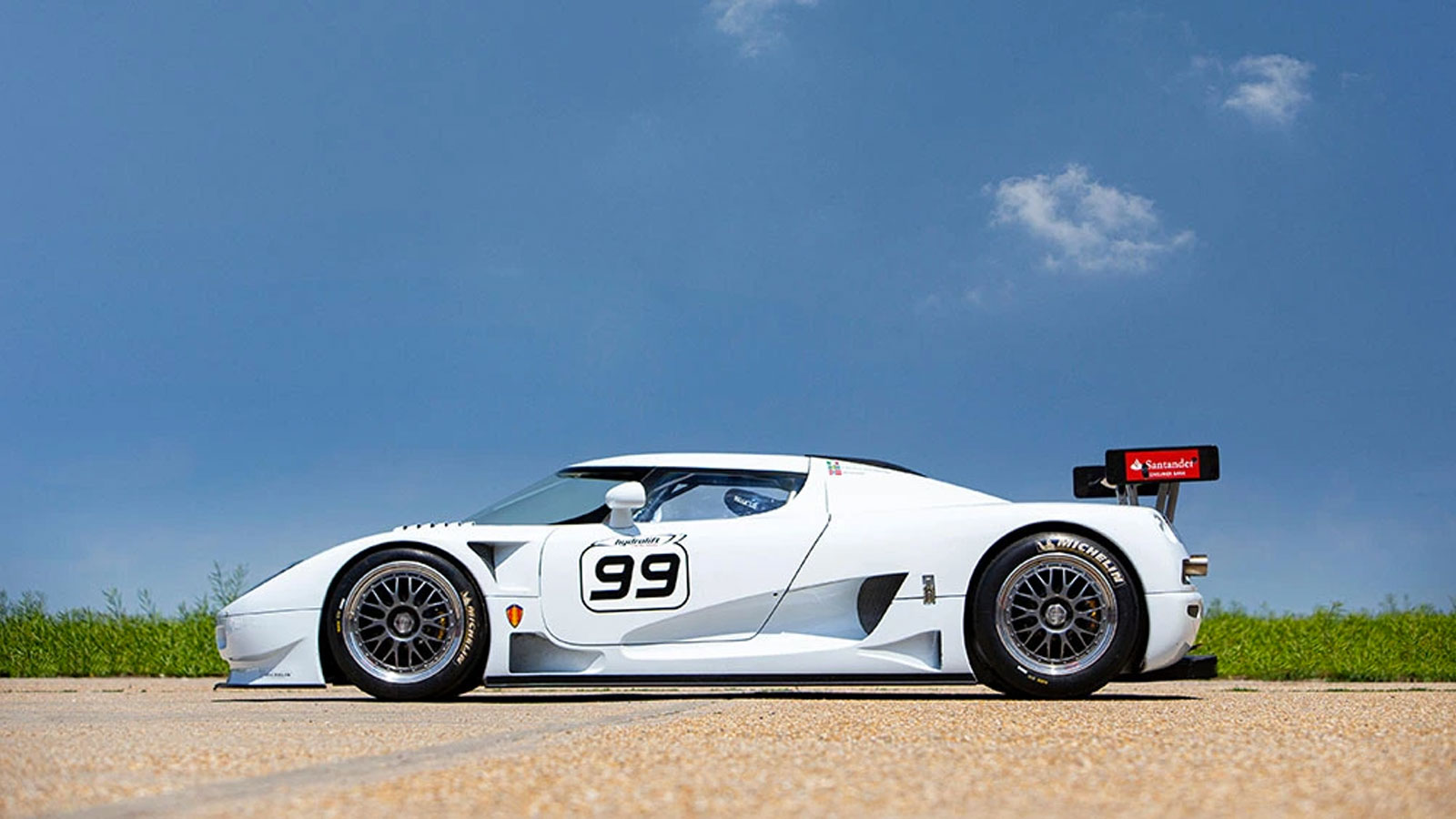 A photo of a white Koenigsegg CCGT GT1 Competition Coupé race car. 