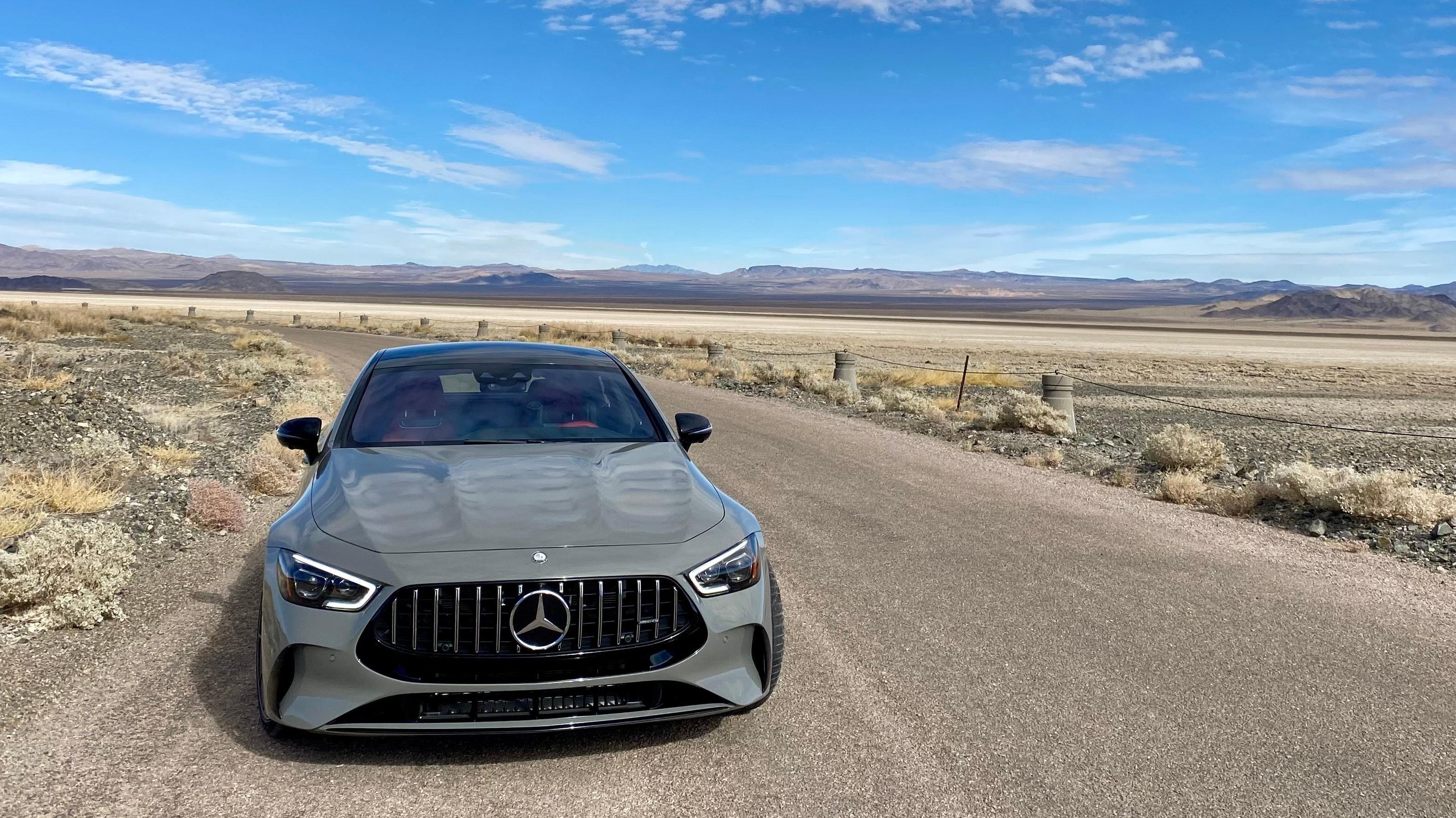 A head on shot of the gray AMG GT parked in the desert