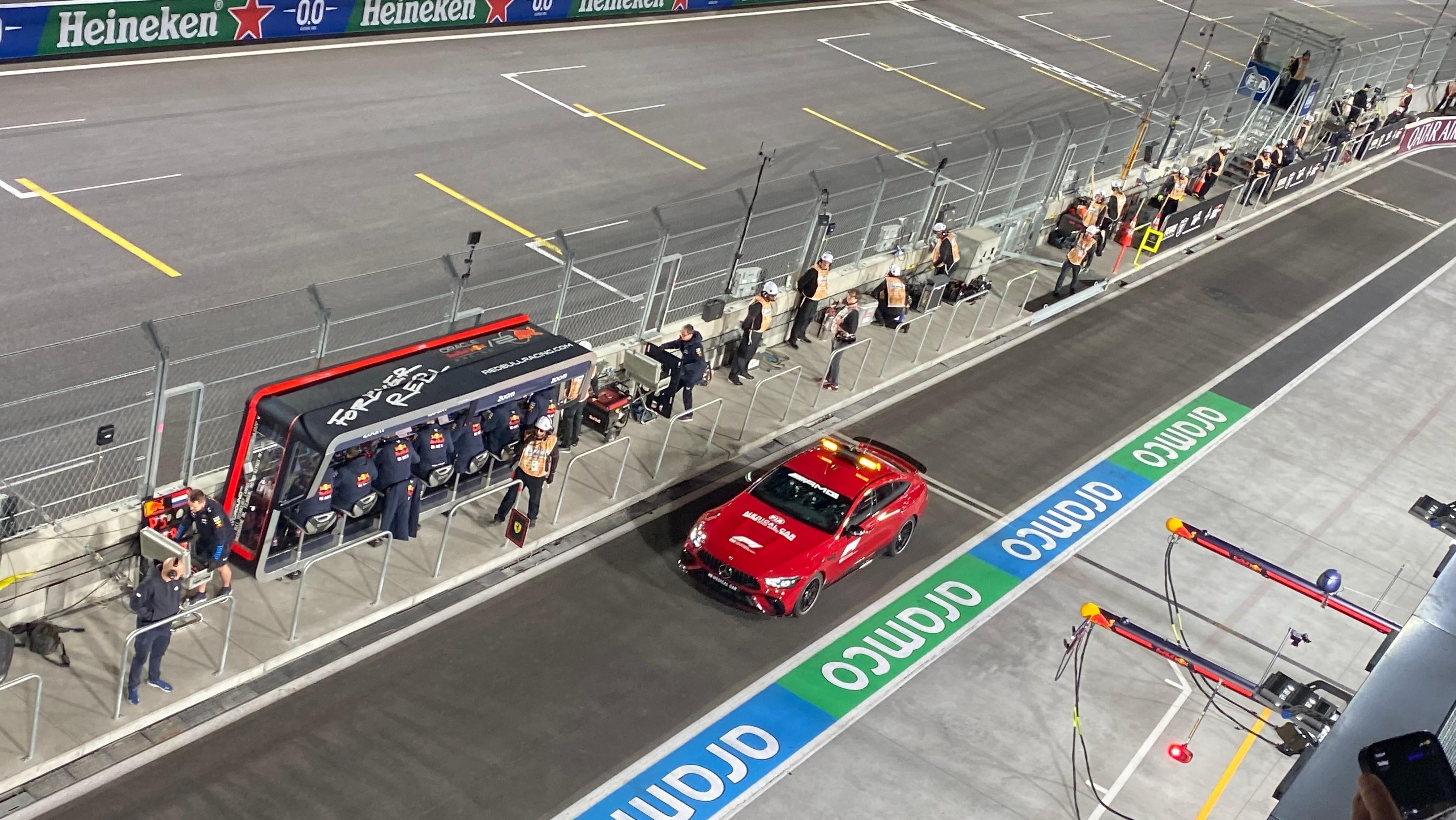 A photo of the red AMG GT63 S safety car driving down pit lane