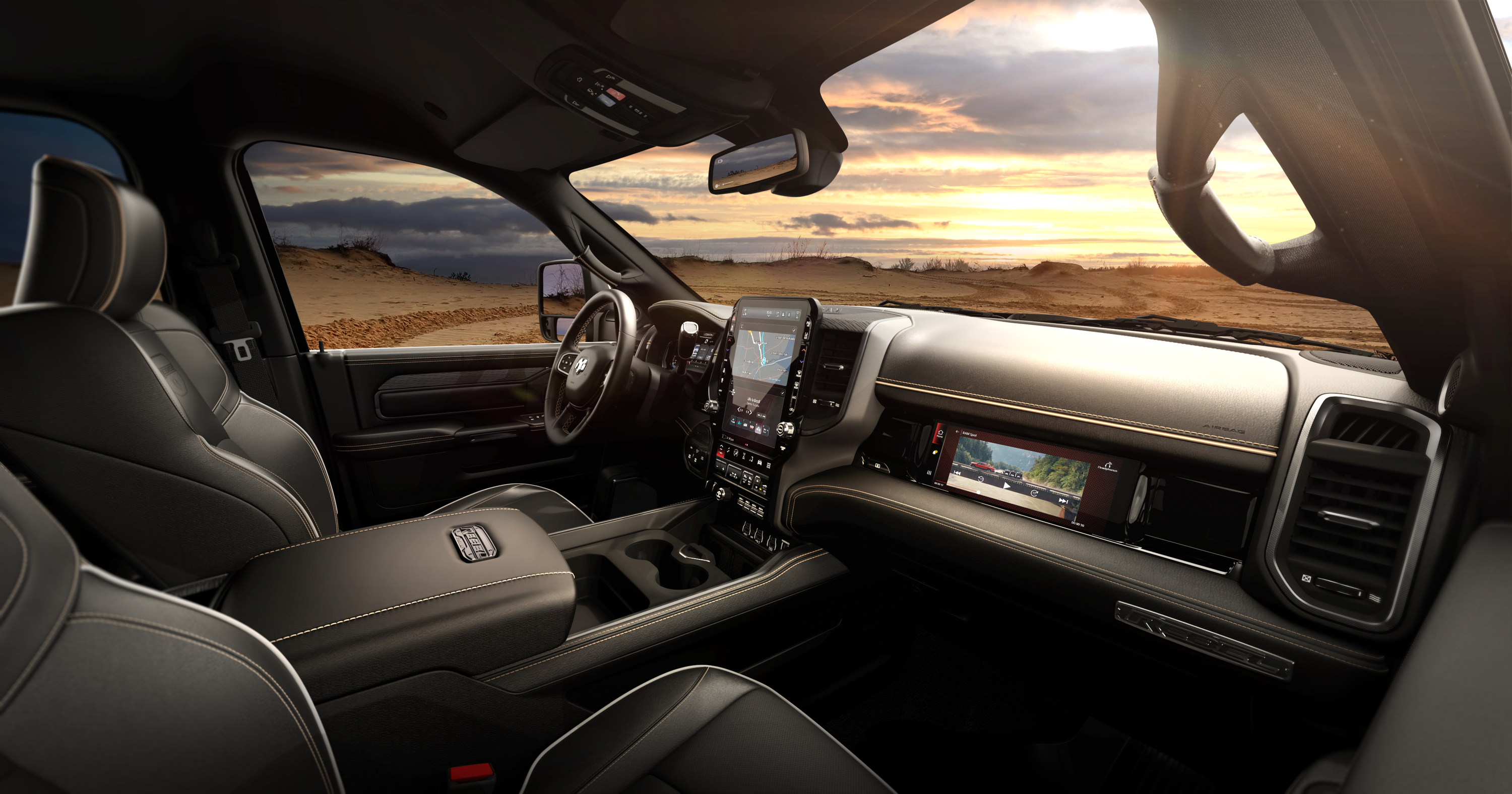 A photo of the new ram HD's interior showing the massive central screen and the passenger screen