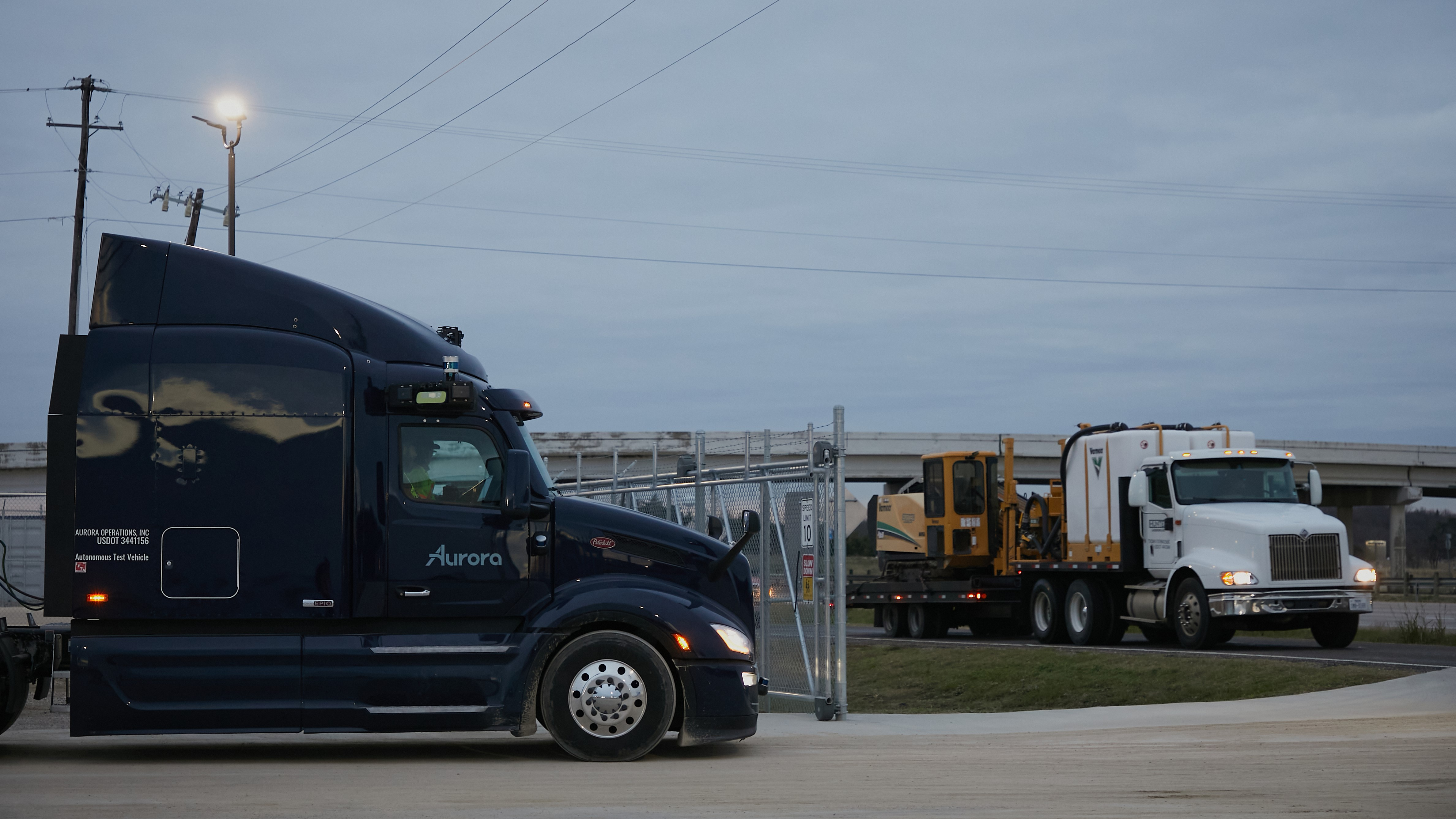 A photo of a self-driving truck on a road. 