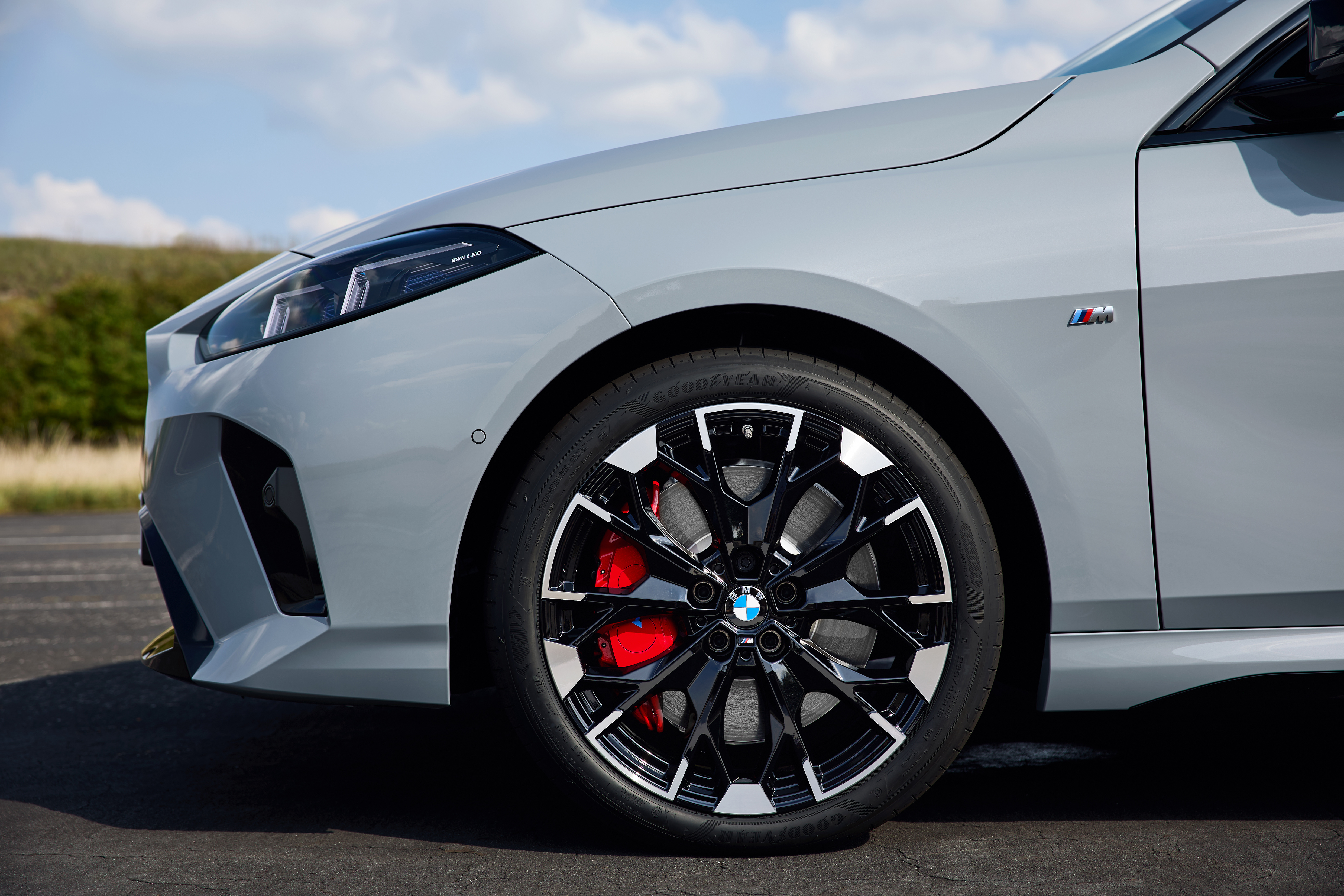 A close up of the front wheel of the new m235i GC