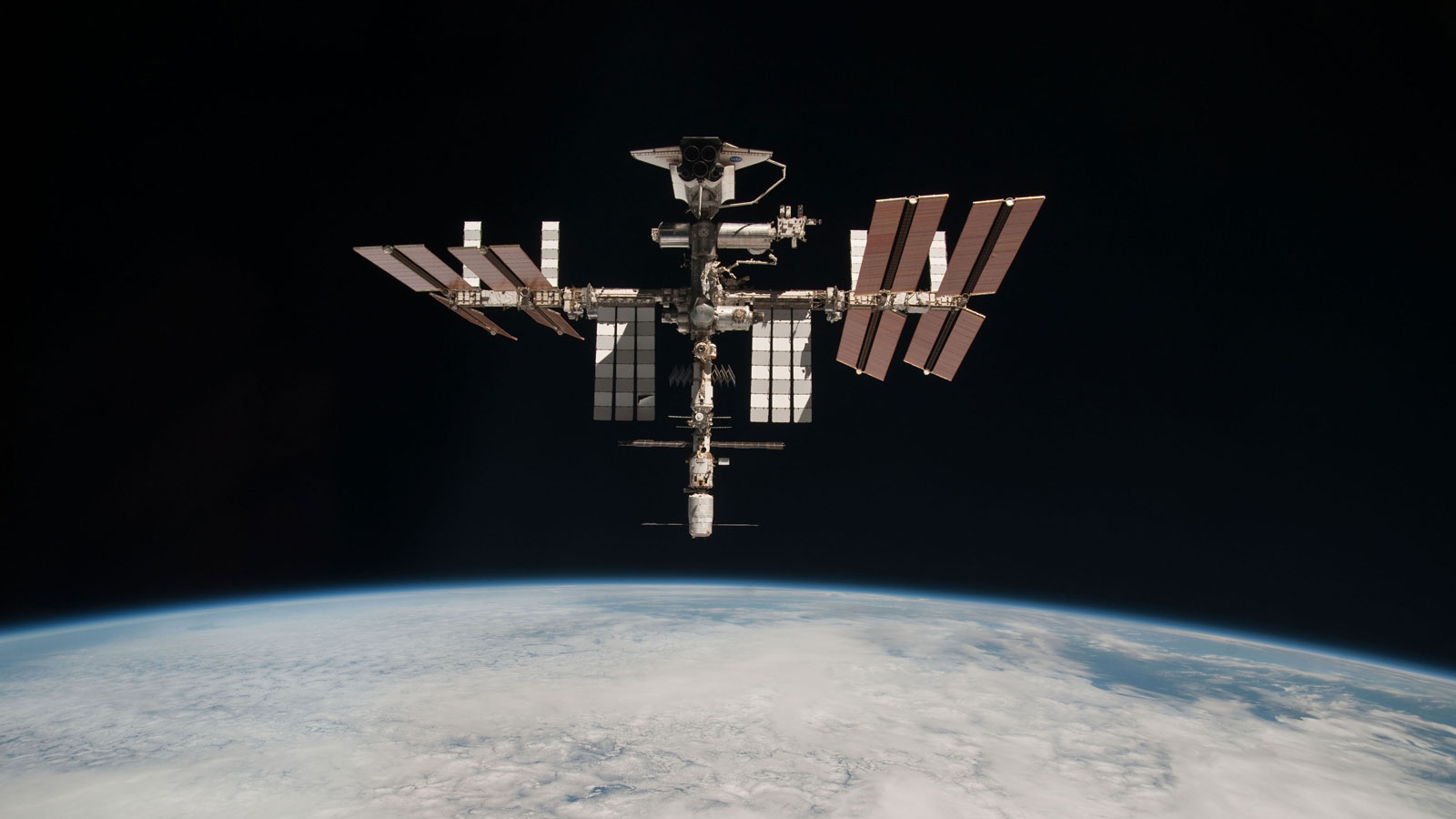 A photo of the ISS with a space shuttle docked. 