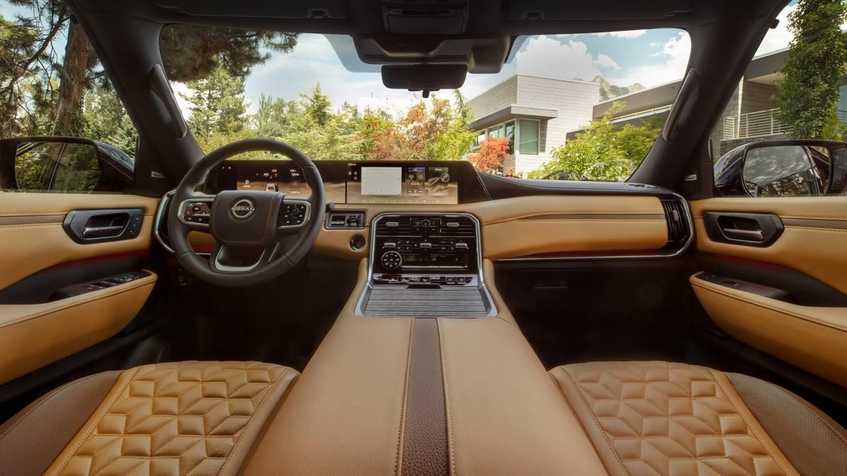 The interior of a platinum reserve trim Armada with quilted orange leather