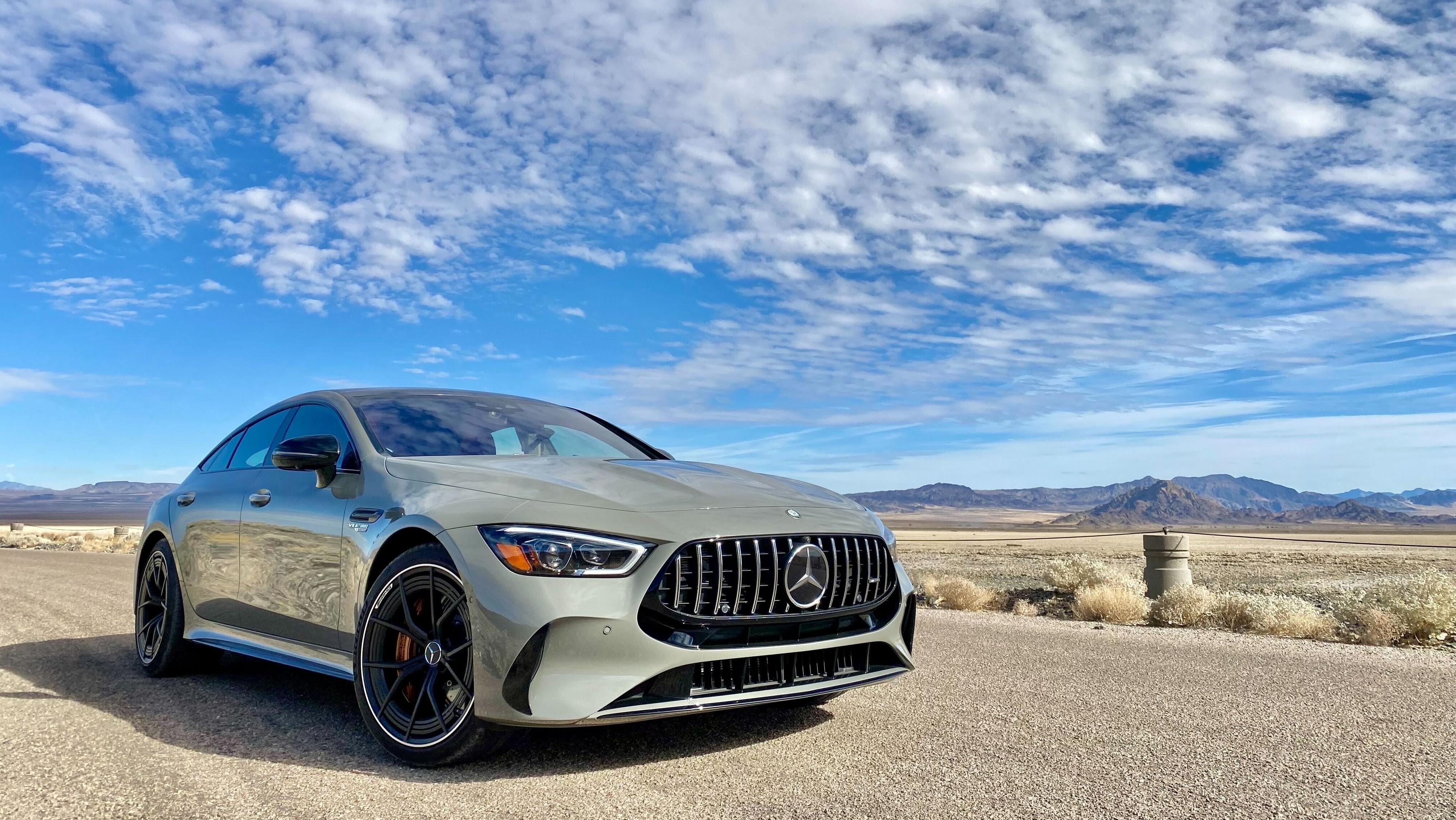 A front three quarters shot of the gray AMG GT in the desert