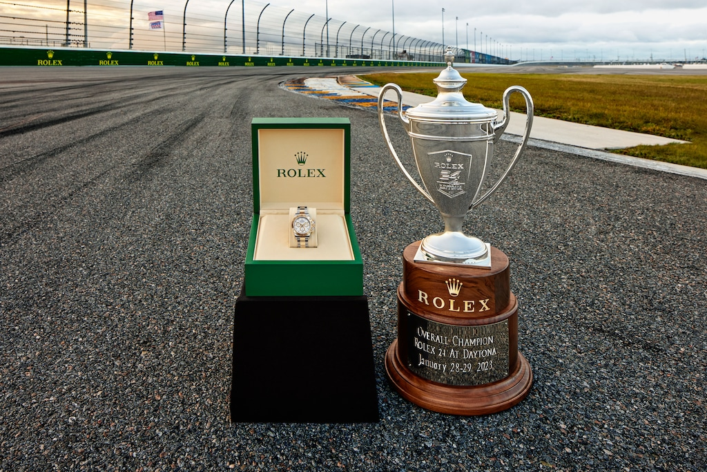 The Rolex cup trophy and a winner's prize Daytona on the track