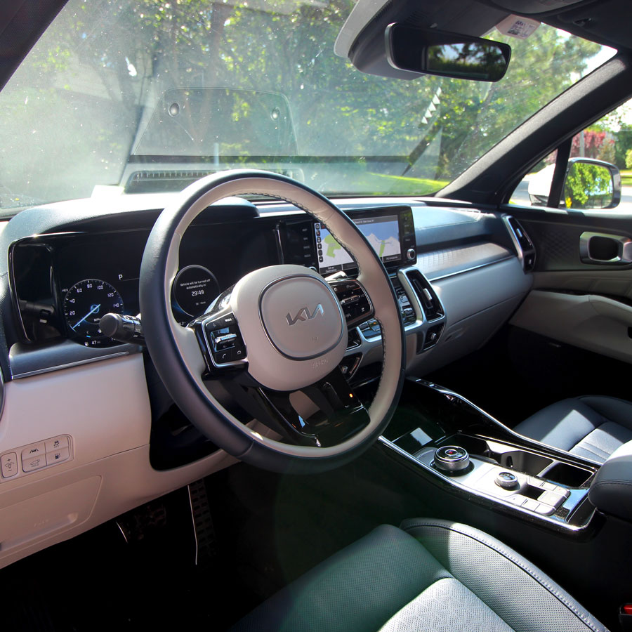 A photo of the driver seat and steering wheel in the Kia Sorento PHEV. 