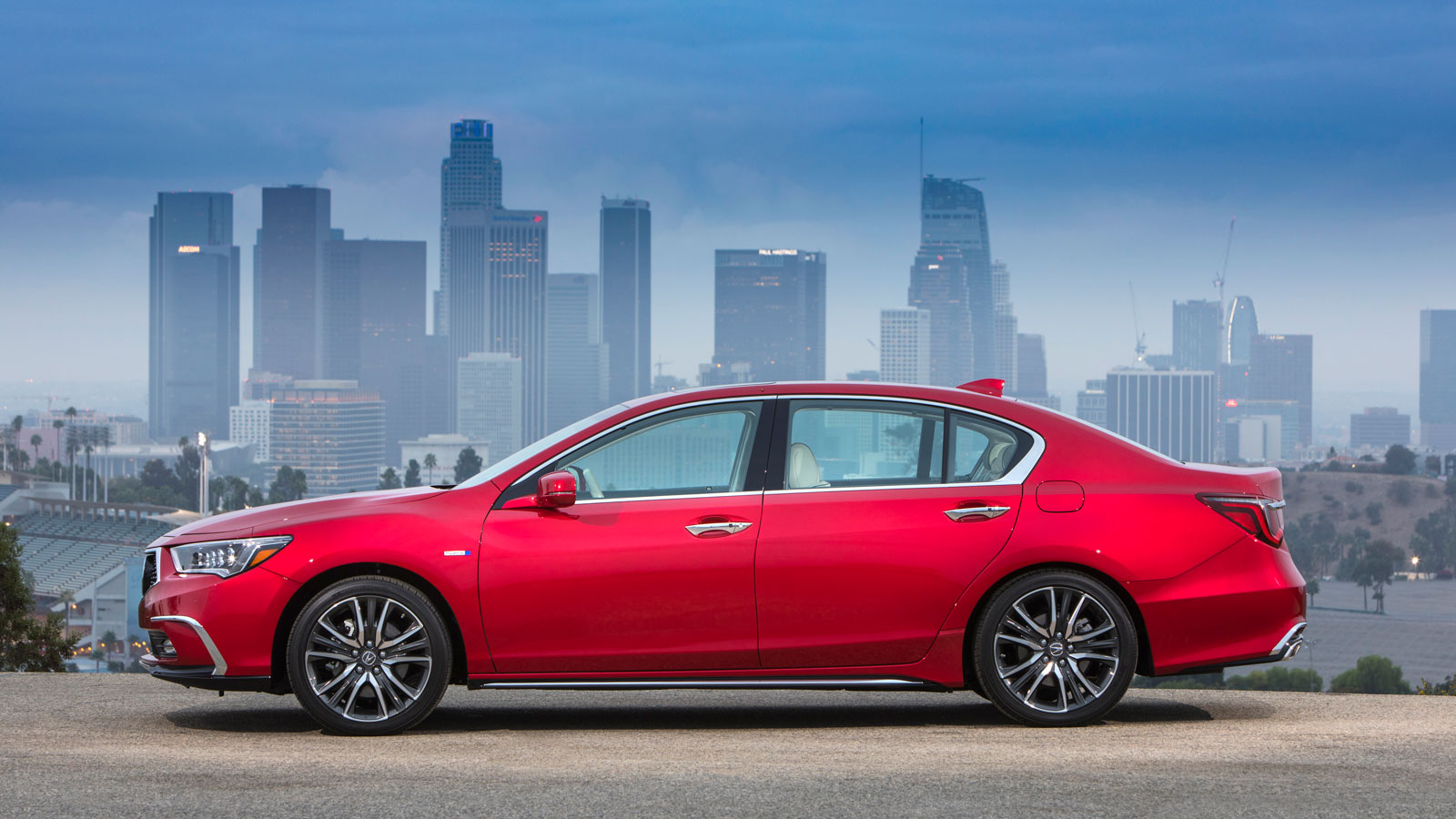 A photo of the side view of an Acura RLX sedan. 