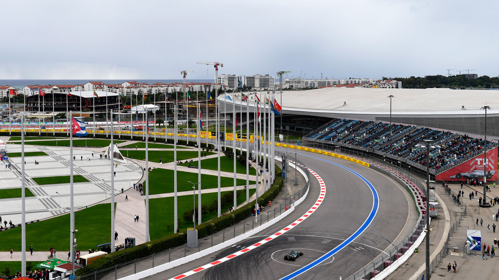 Lance Stroll races his green Aston martin F1 car in Russia. 