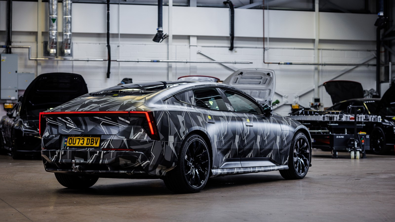 A photo of the Polestar 5 prototype at a factory in the UK. 