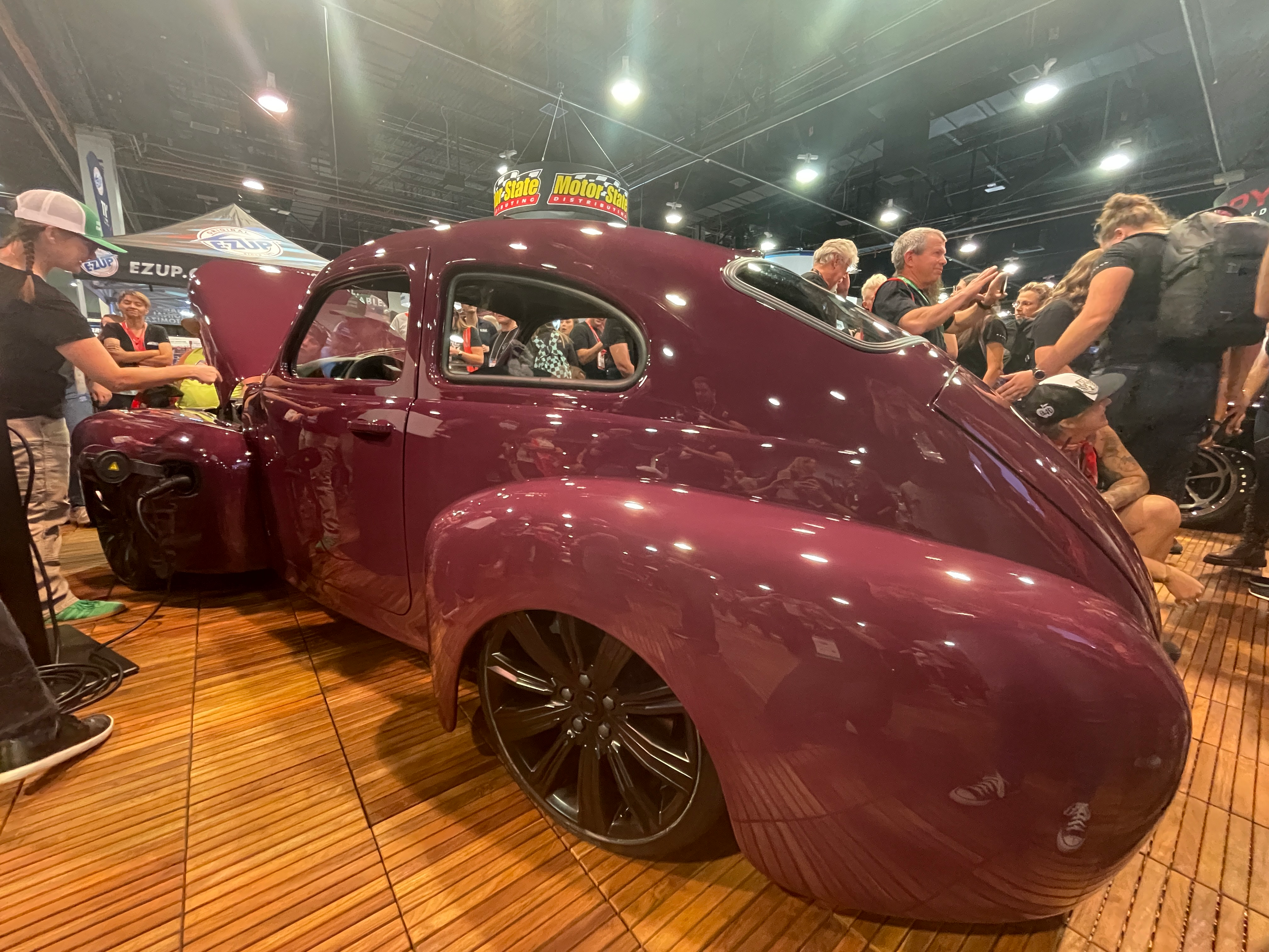 Driver's-side tail shot of the Iron Maven Volvo restomod on the SEMA floor