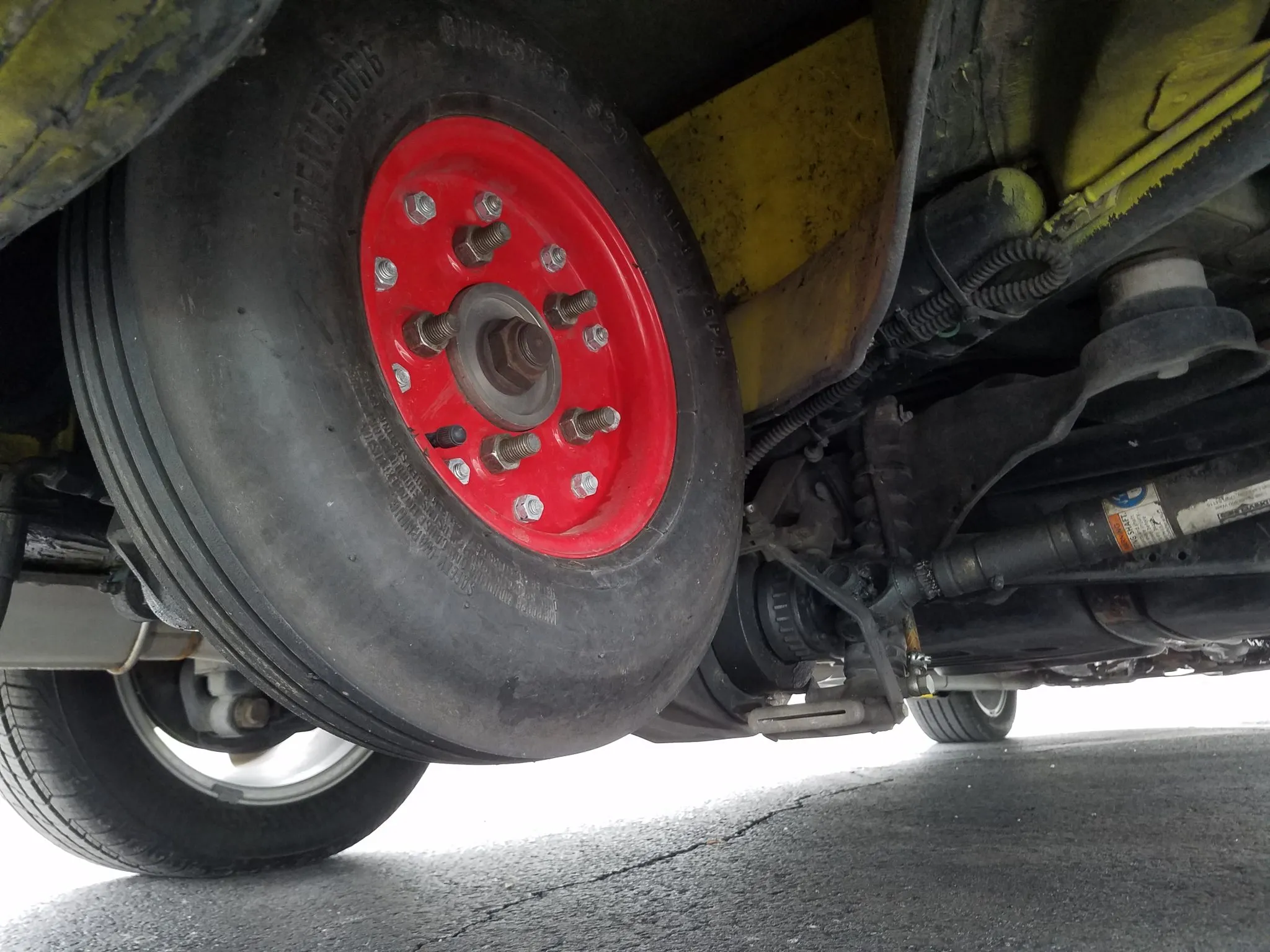 a photo of the retracted underbody mounted airplane wheel at the rear of the 9-5 wagon