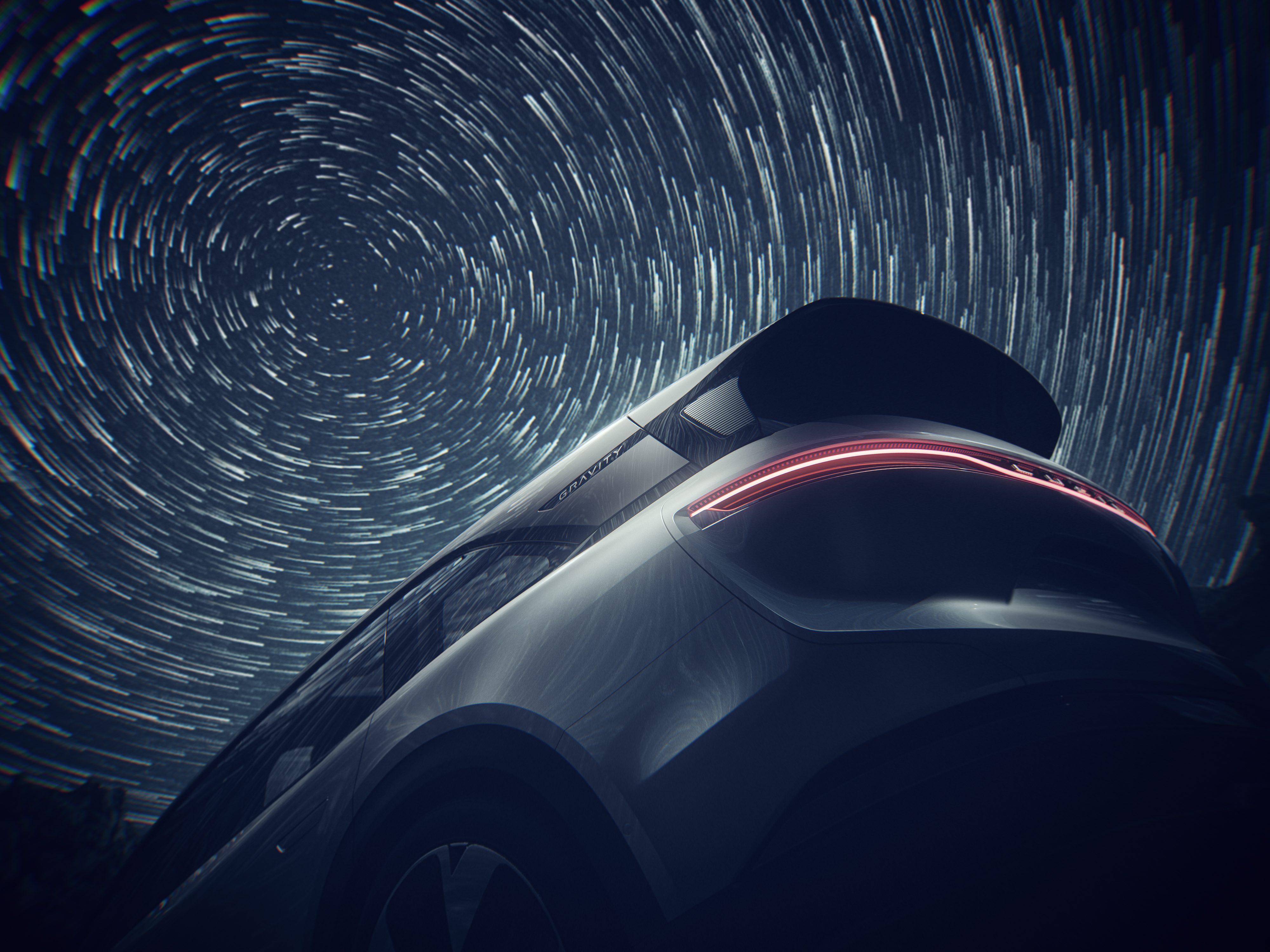 2024 Lucid Gravity rear three-quarters view with long-exposure stars in the sky