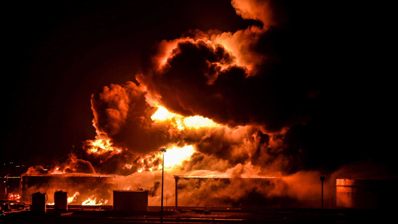 A photo of flames engulfing an oil refinery in Saudi Arabia. 