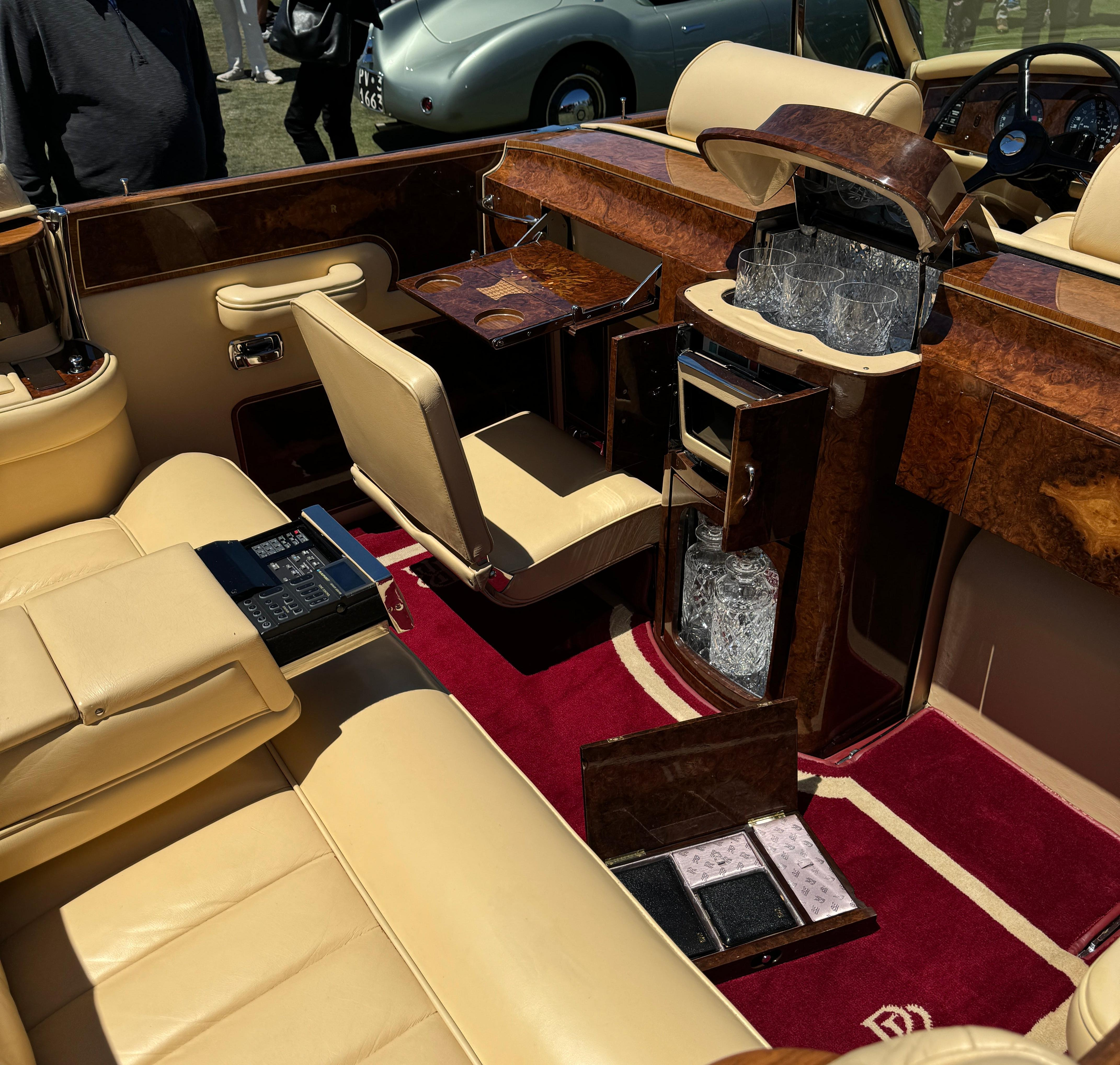 Rear seat of the red 1971 Rolls-Royce Phantom VI Frua All-Weather Cabriolet