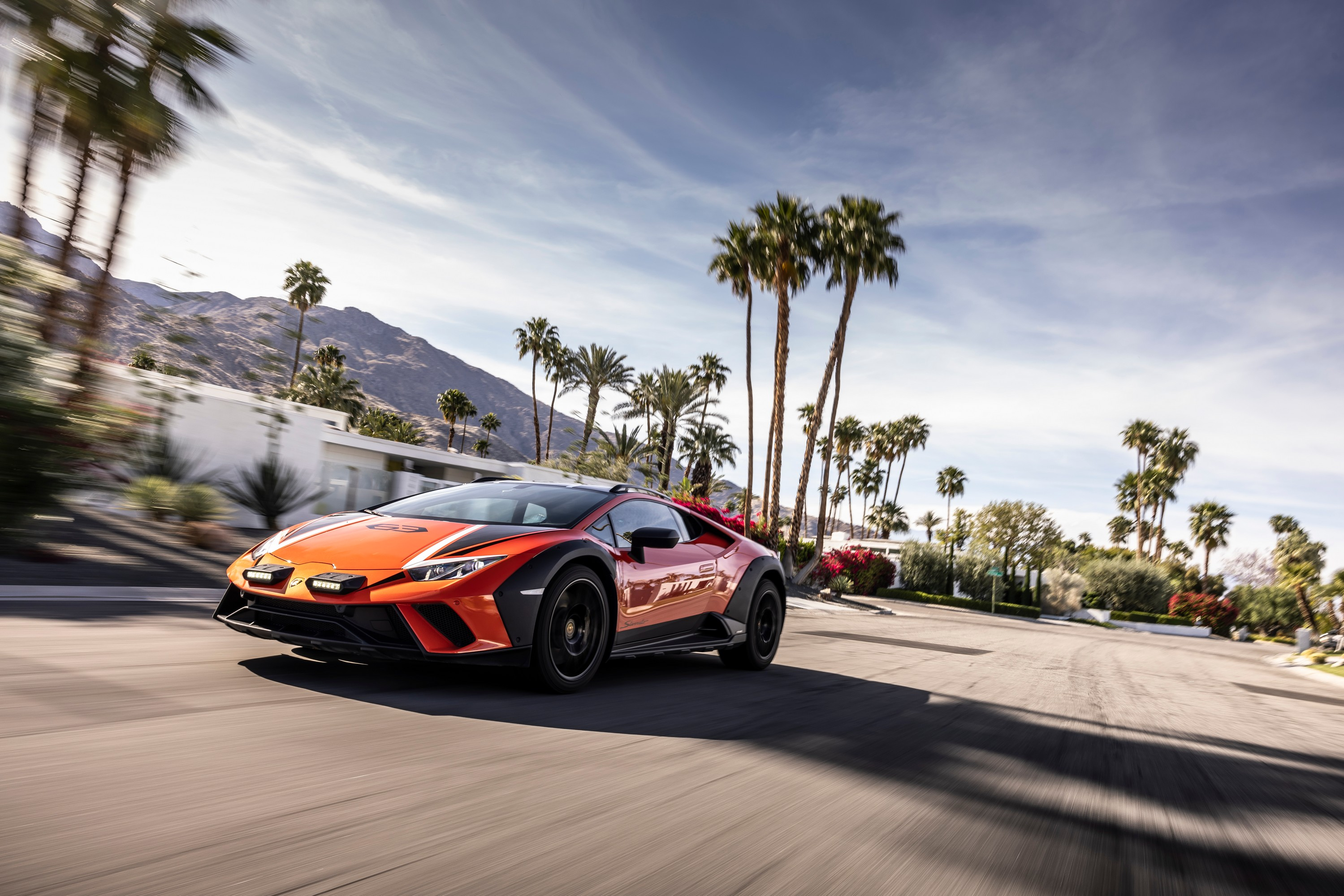 Front three quarter view of the 2024 Lamborghini Huracan Sterrato driving in Palm Springs, CA