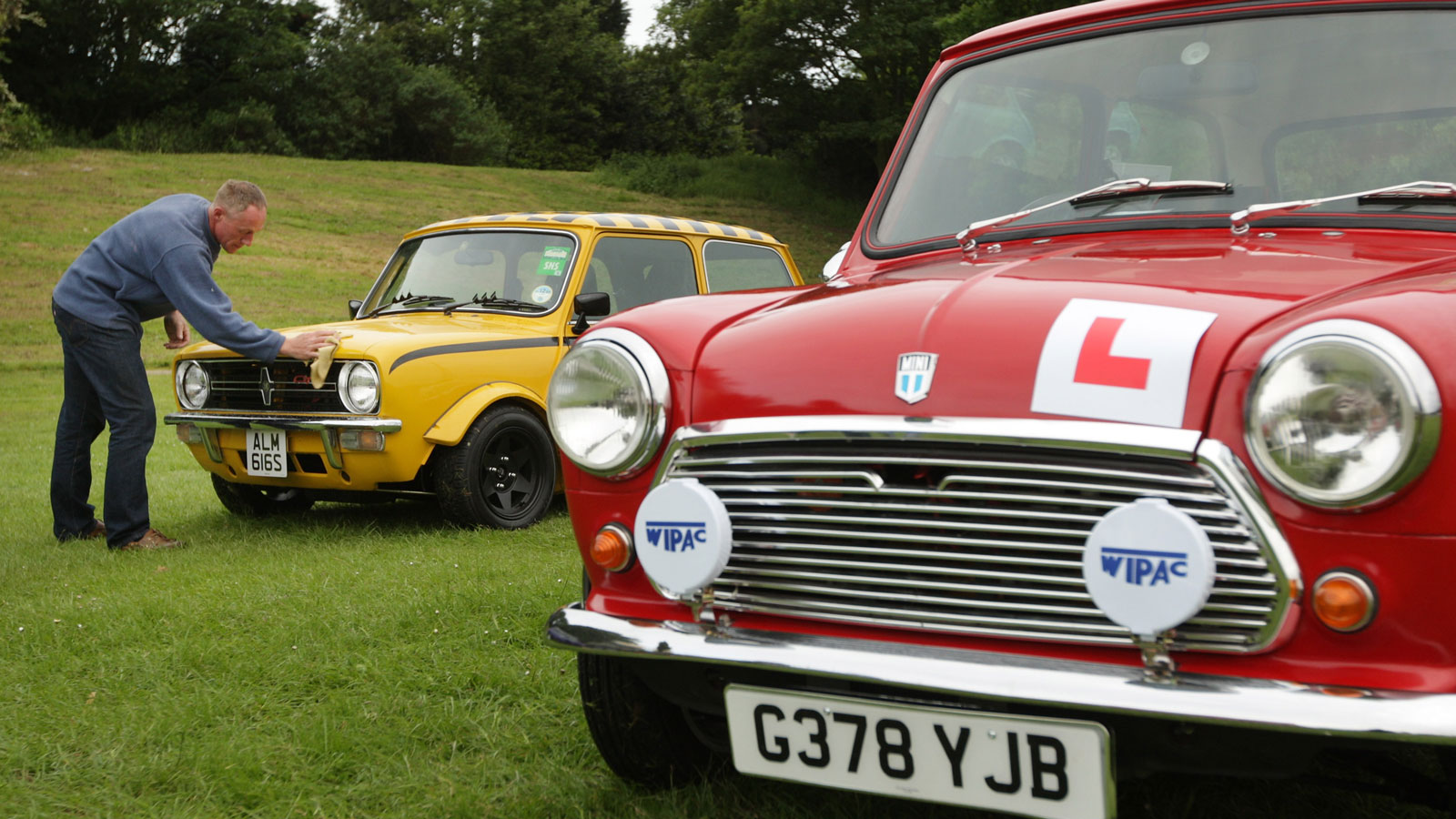 A red vintage Mini with a learner badge stuck to the front. 