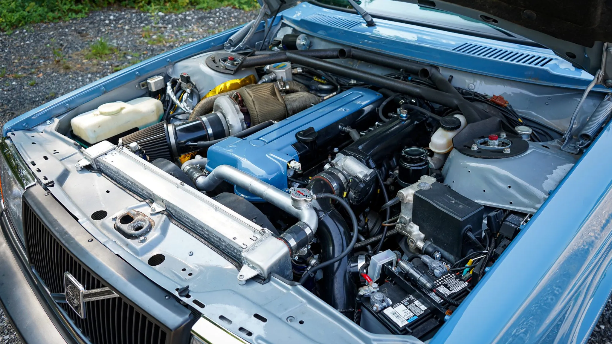 an under-hood shot of the Volvo's turbocharged 2JZ motor