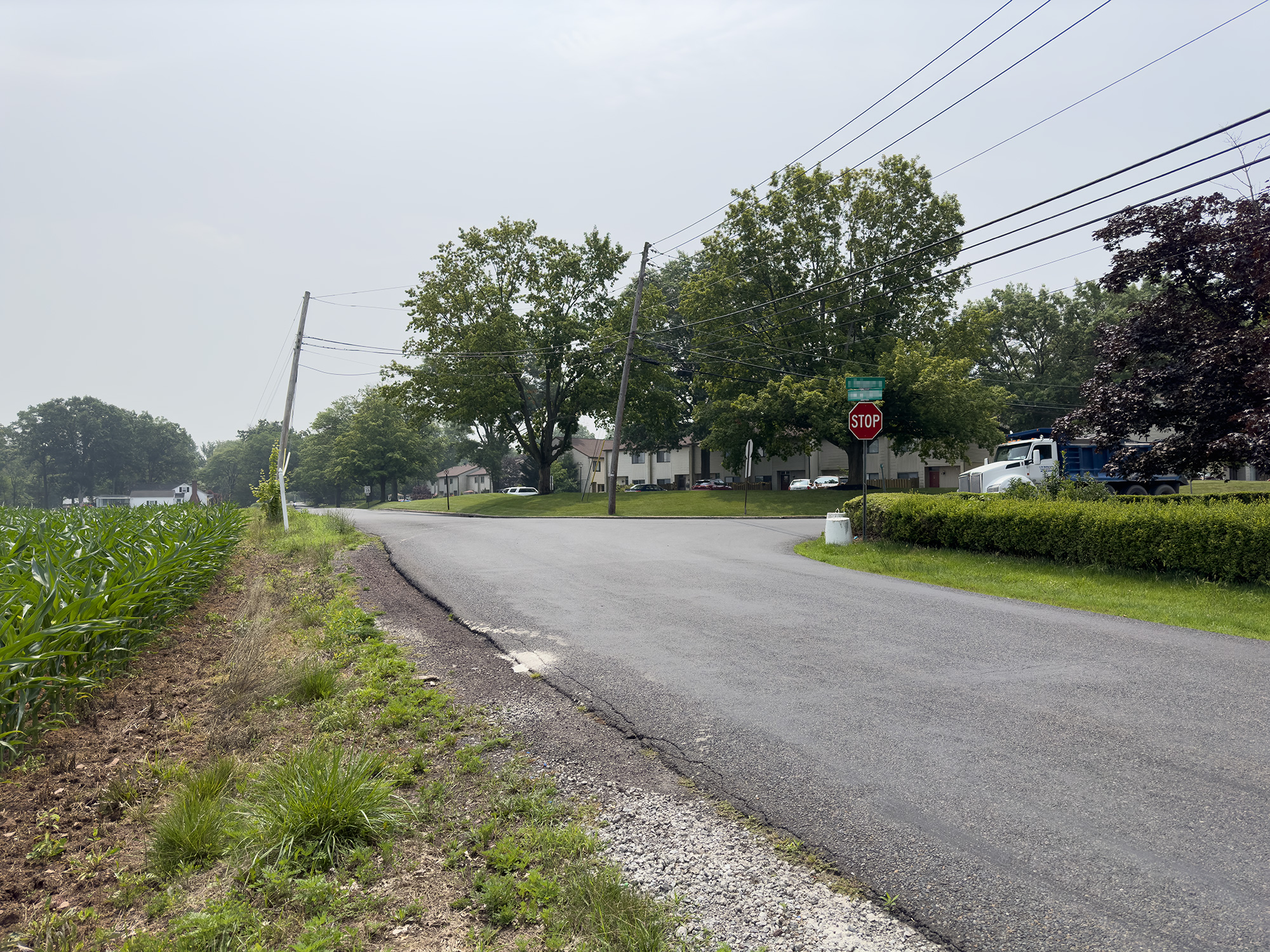 Photo of the same intersection as earlier, but taken from another road meeting it that has a normal 