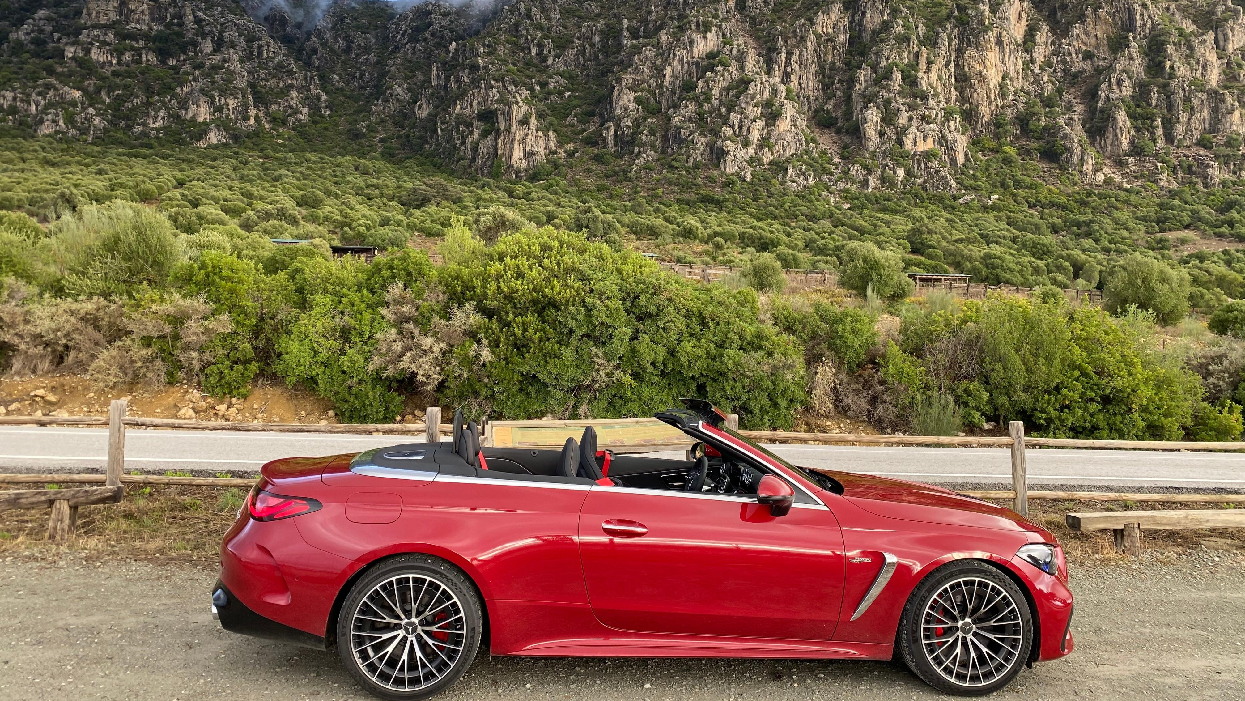 a side-view of a red CLE in front of mountains