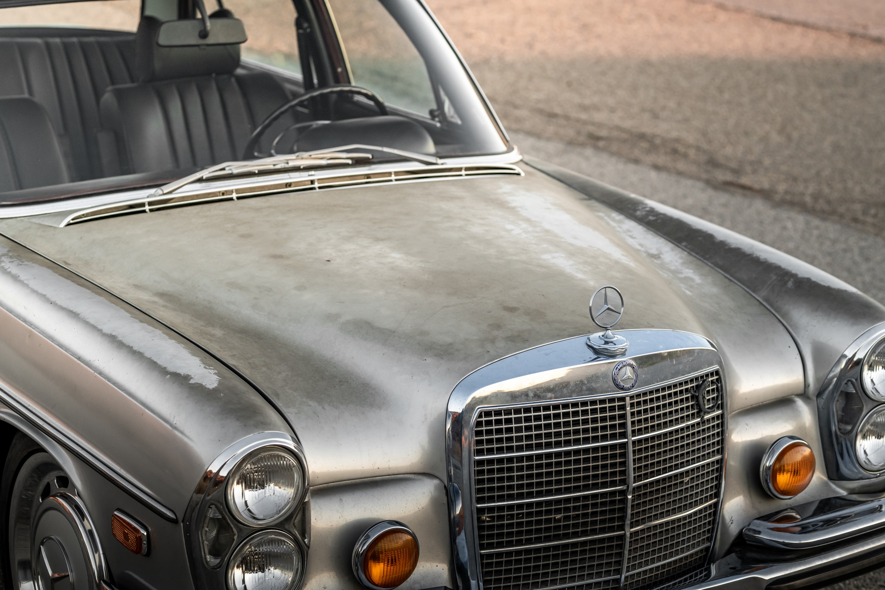 A faded silver hood on a 1971 Mercedes-Benz 300SEL 6.3