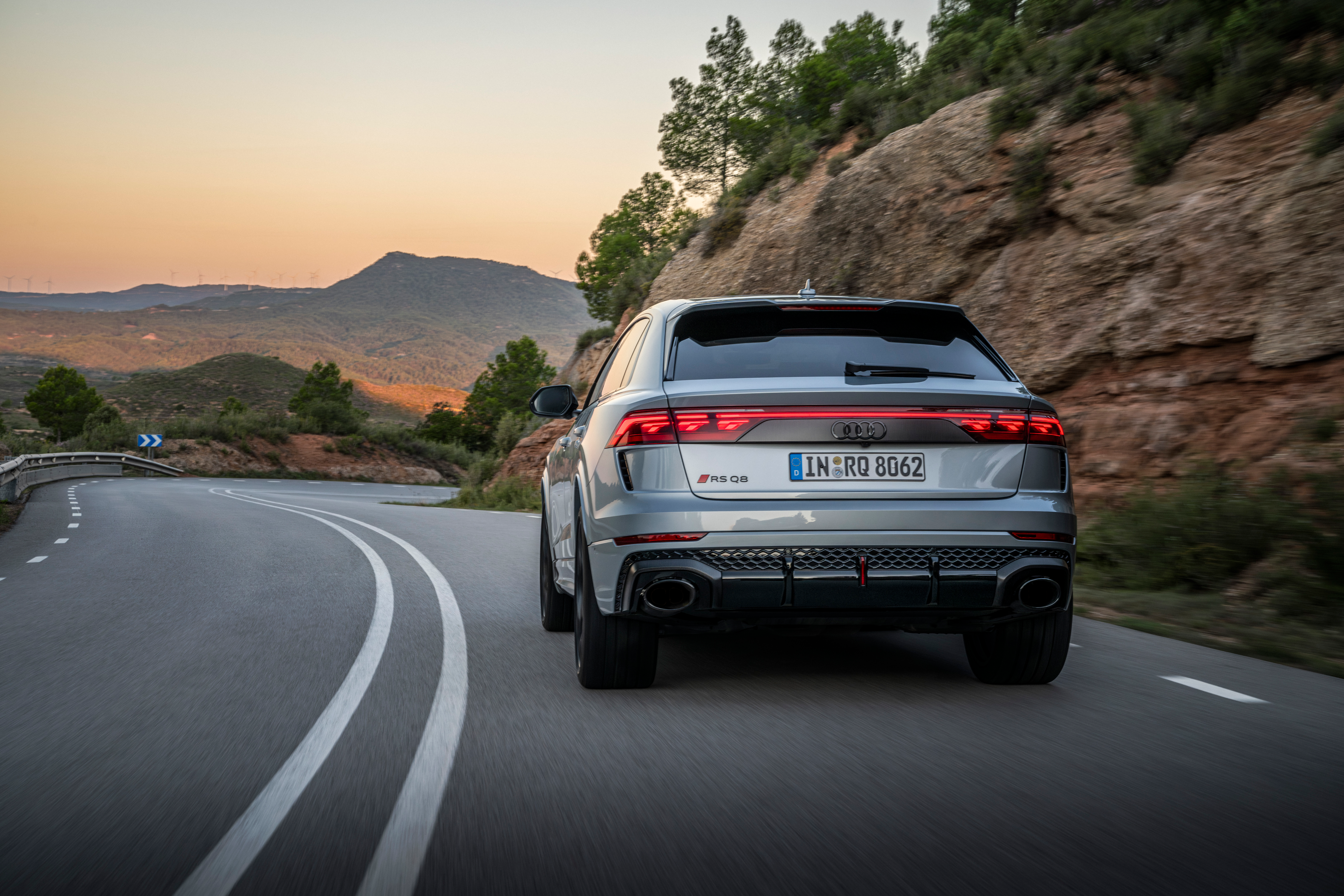 Rear 3/4 view of a silver 2025 Audi RS Q8 Performance